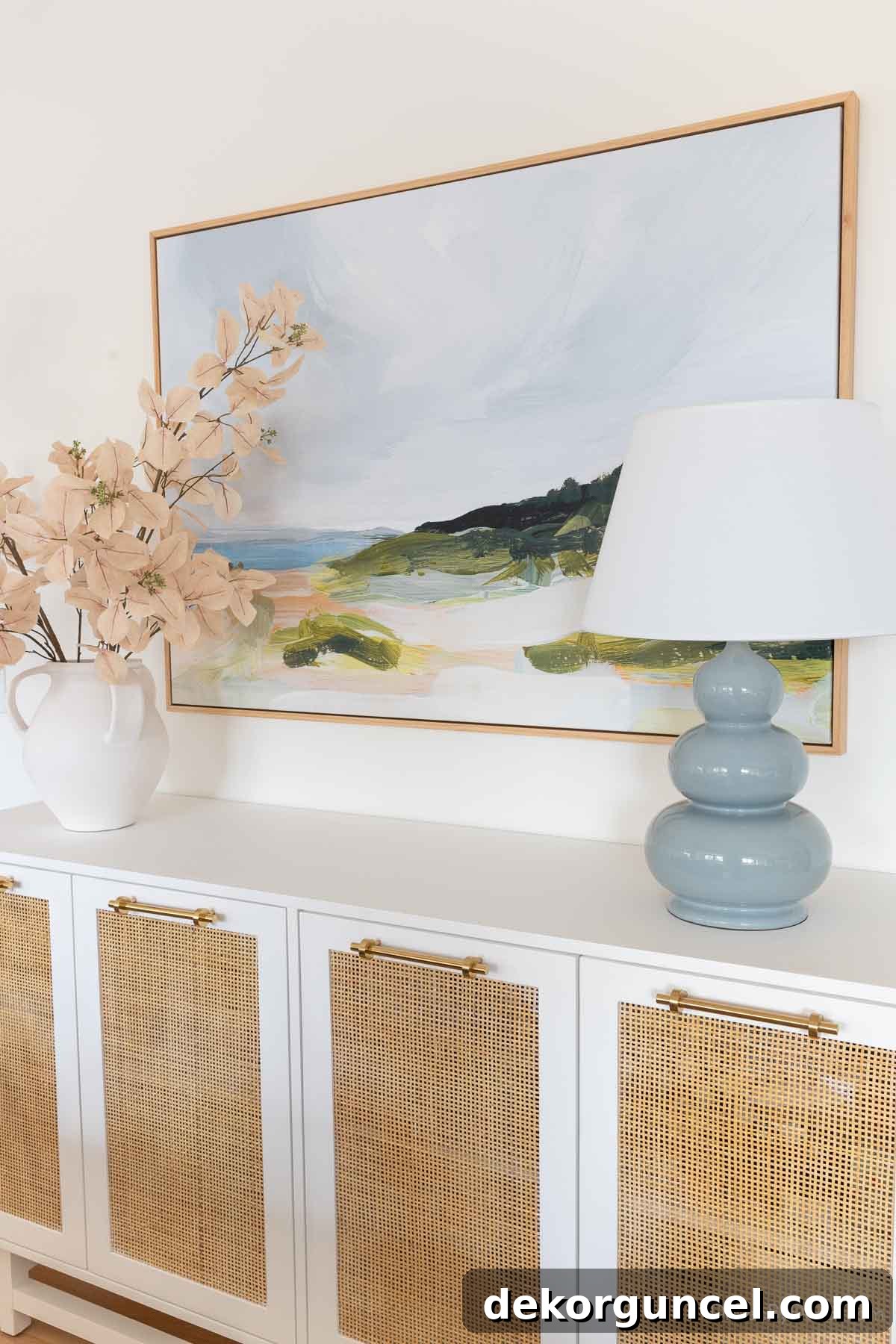 Large canvas wrapped print with floating wood frame over dining room console