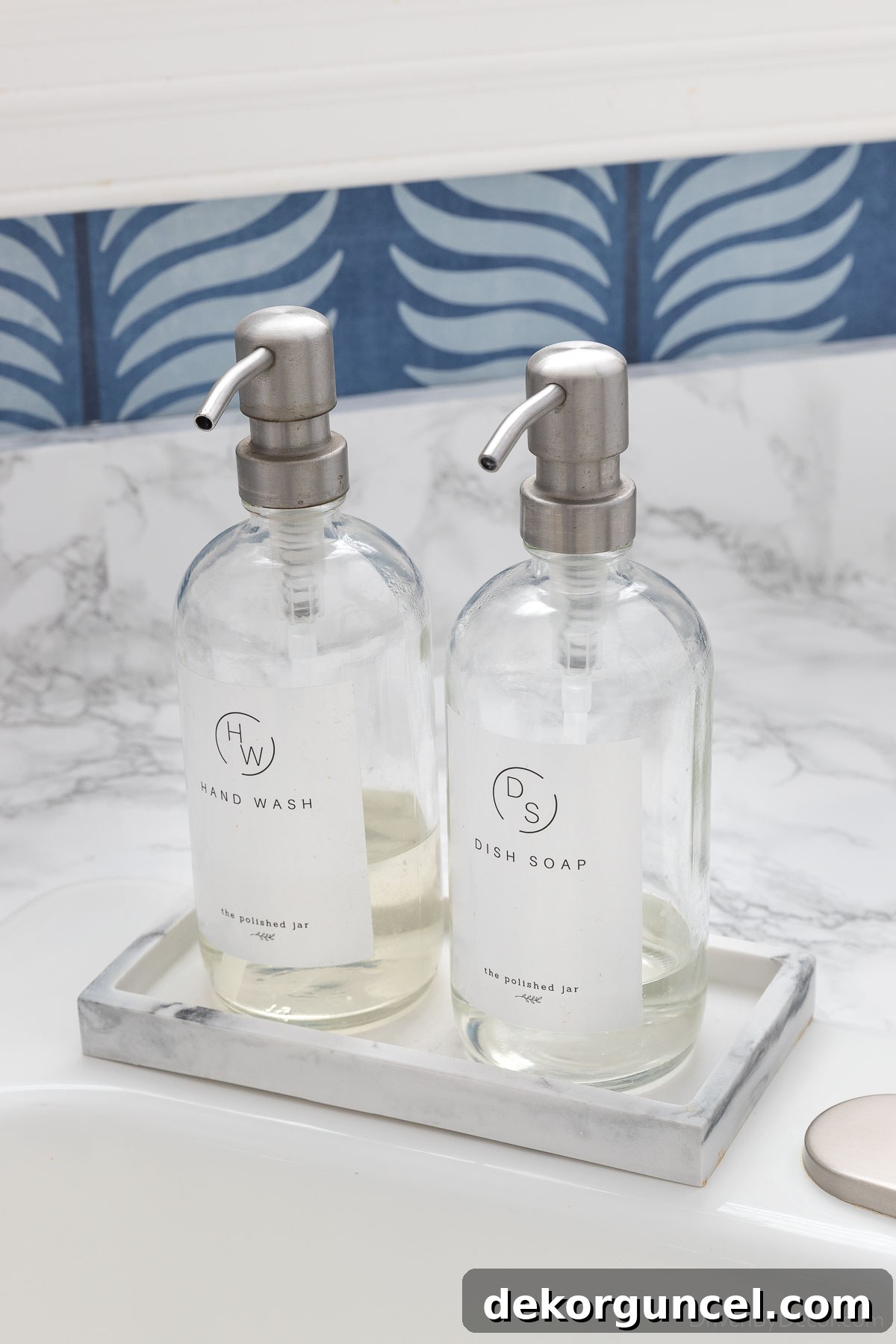 Soap pumps in small tray next to our kitchen sink
