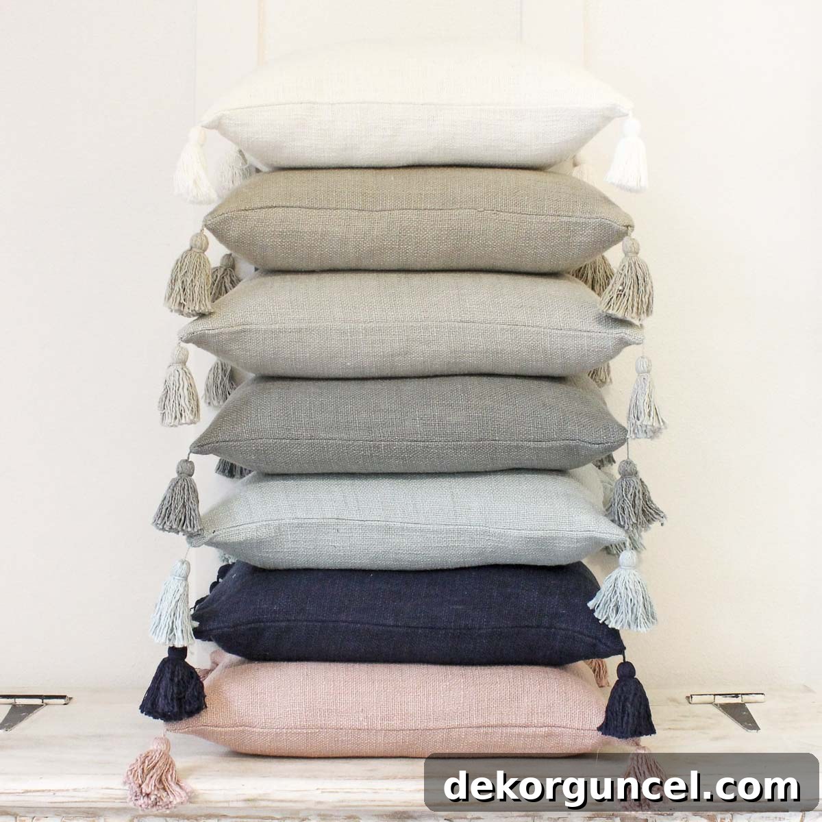 Tasseled pillow covers from Etsy in seven color options