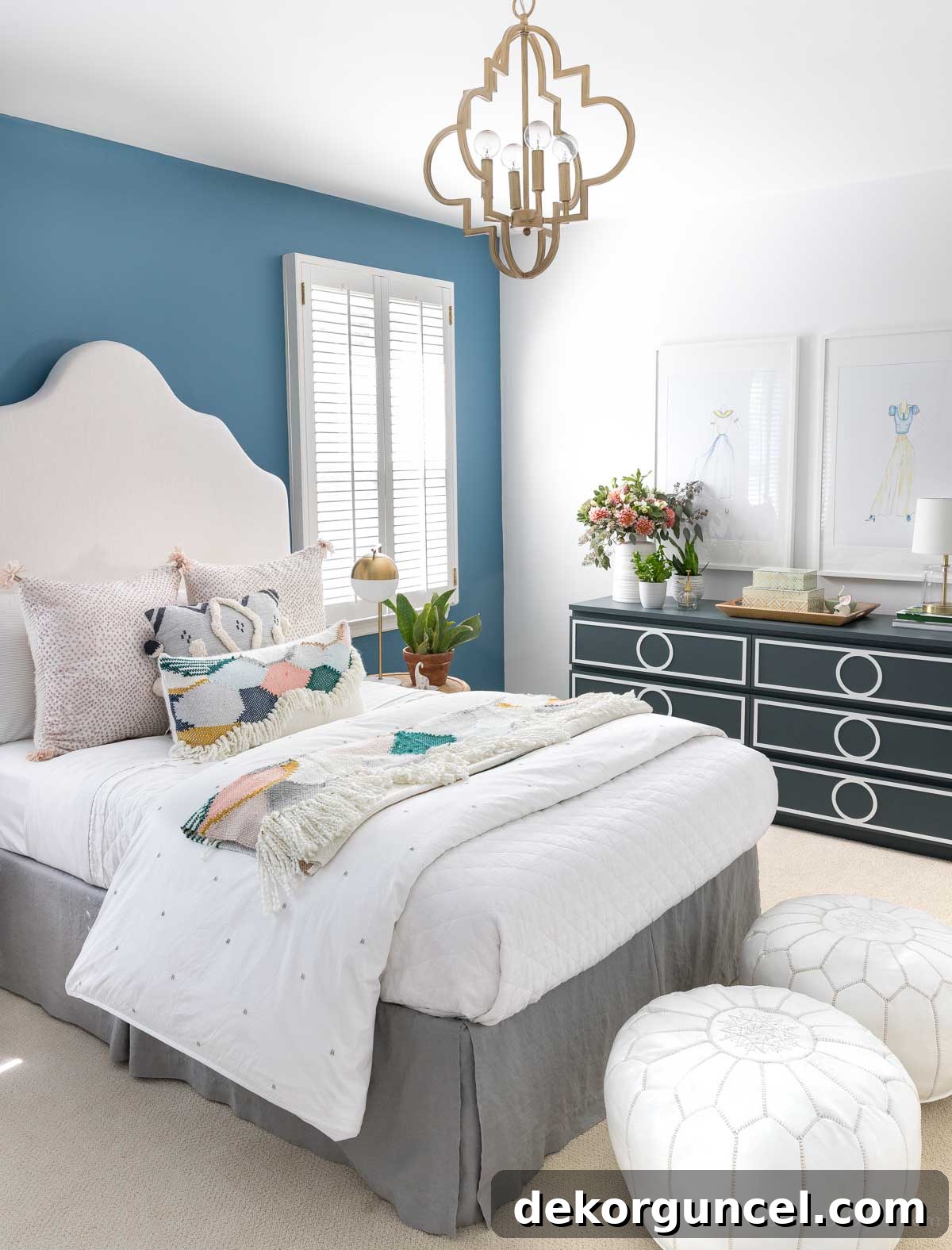 Pair of Moroccan leather poufs at end of bed
