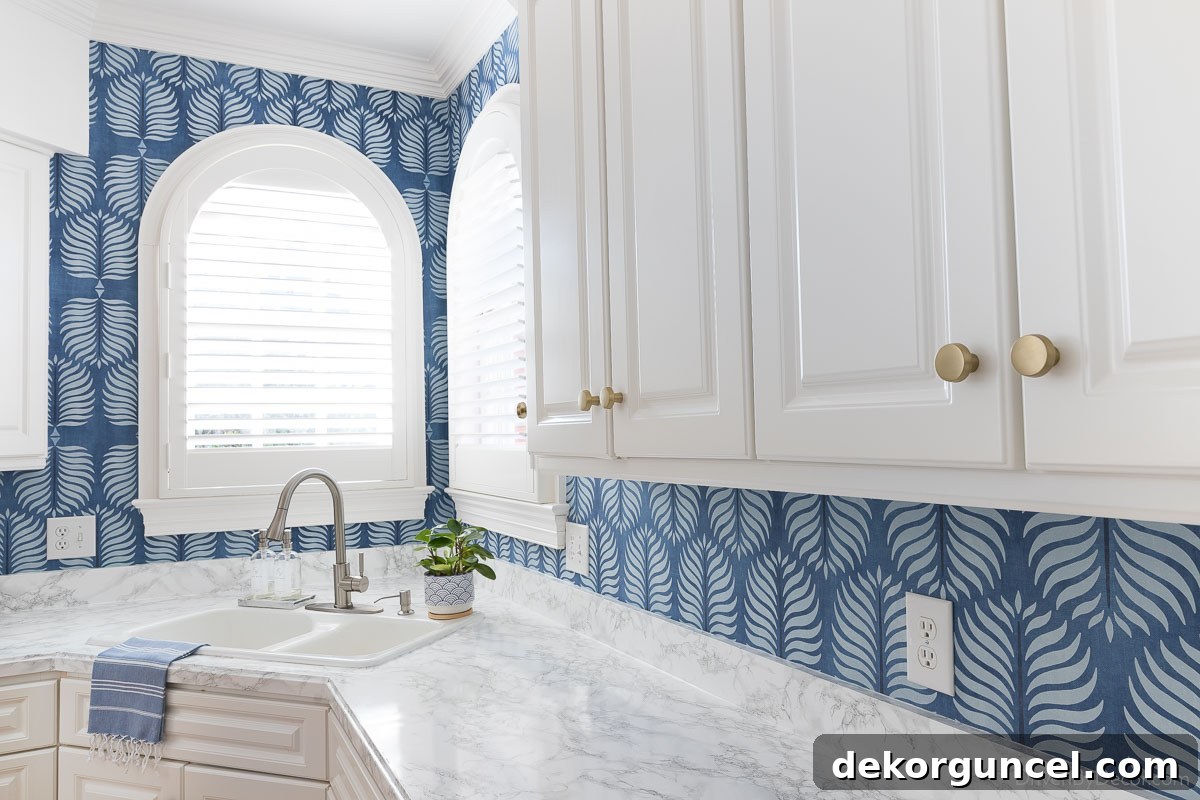 Detailed shot of adding wallpaper to our kitchen backsplash, highlighting the process.