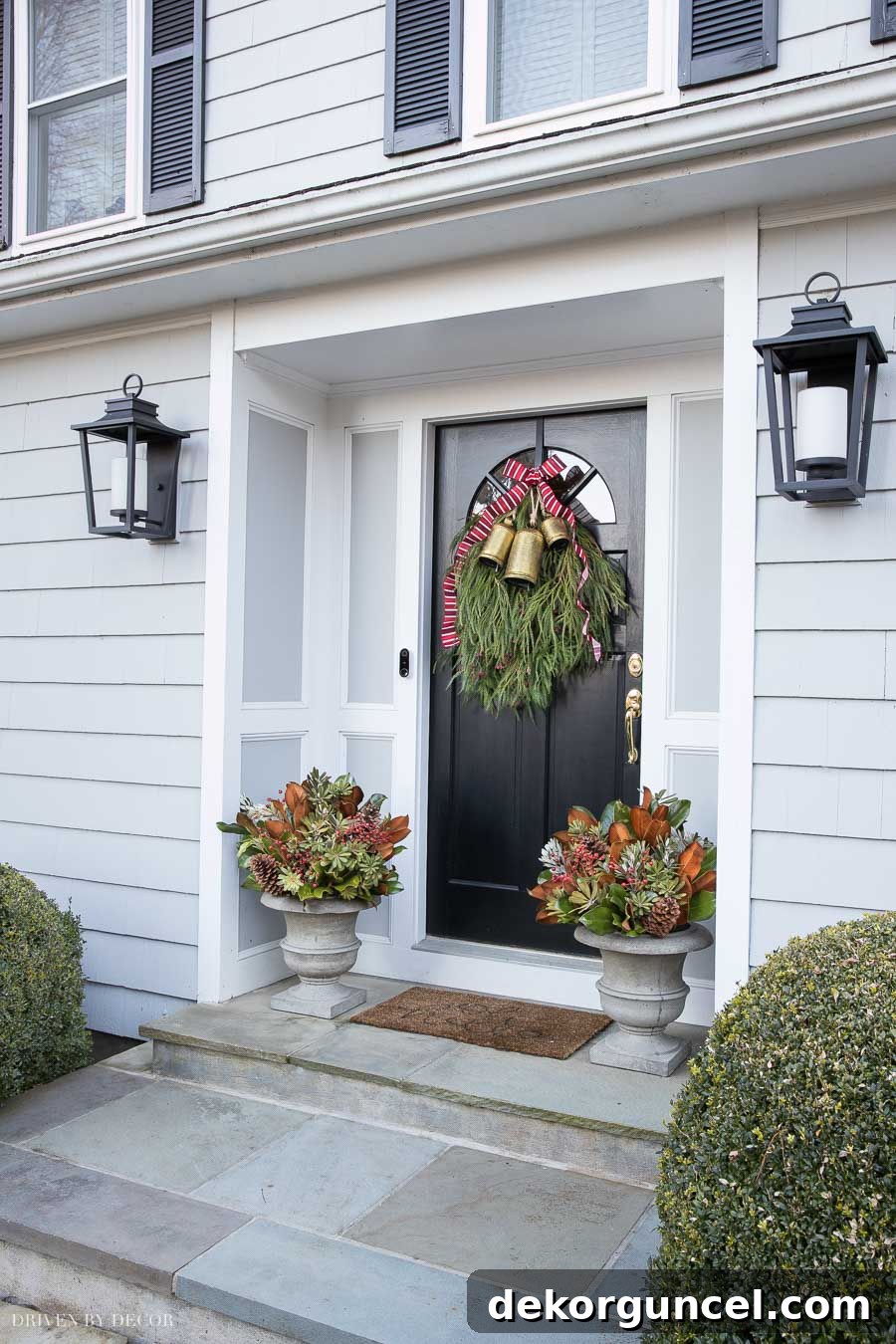Our Christmas front porch with a DIY door swag and planters - how-to included in post!