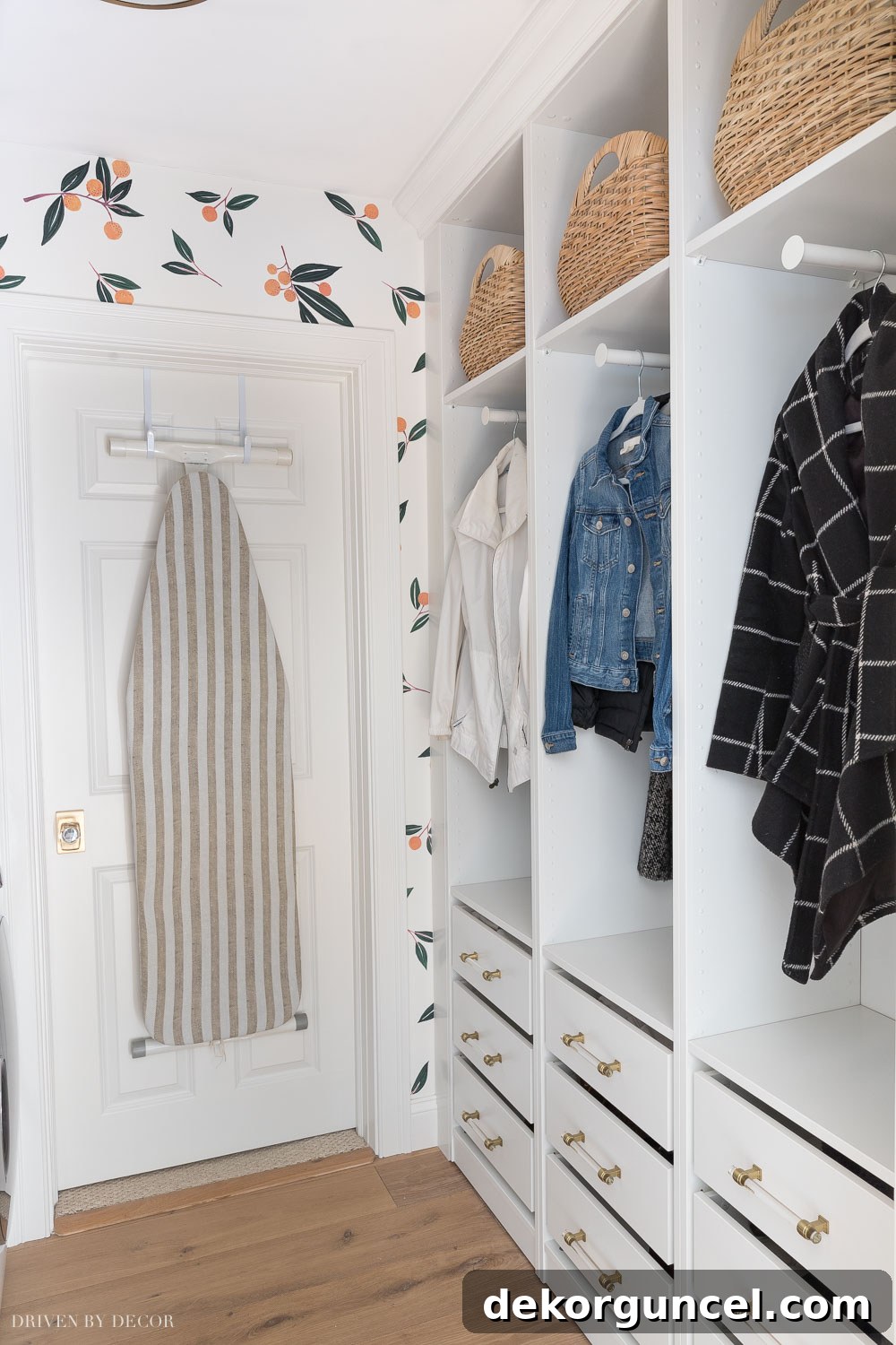 IKEA Pax wardrobes skillfully integrated into a laundry room, providing organized storage cubbies for coats and drawers for shoes, creating a functional mudroom space.