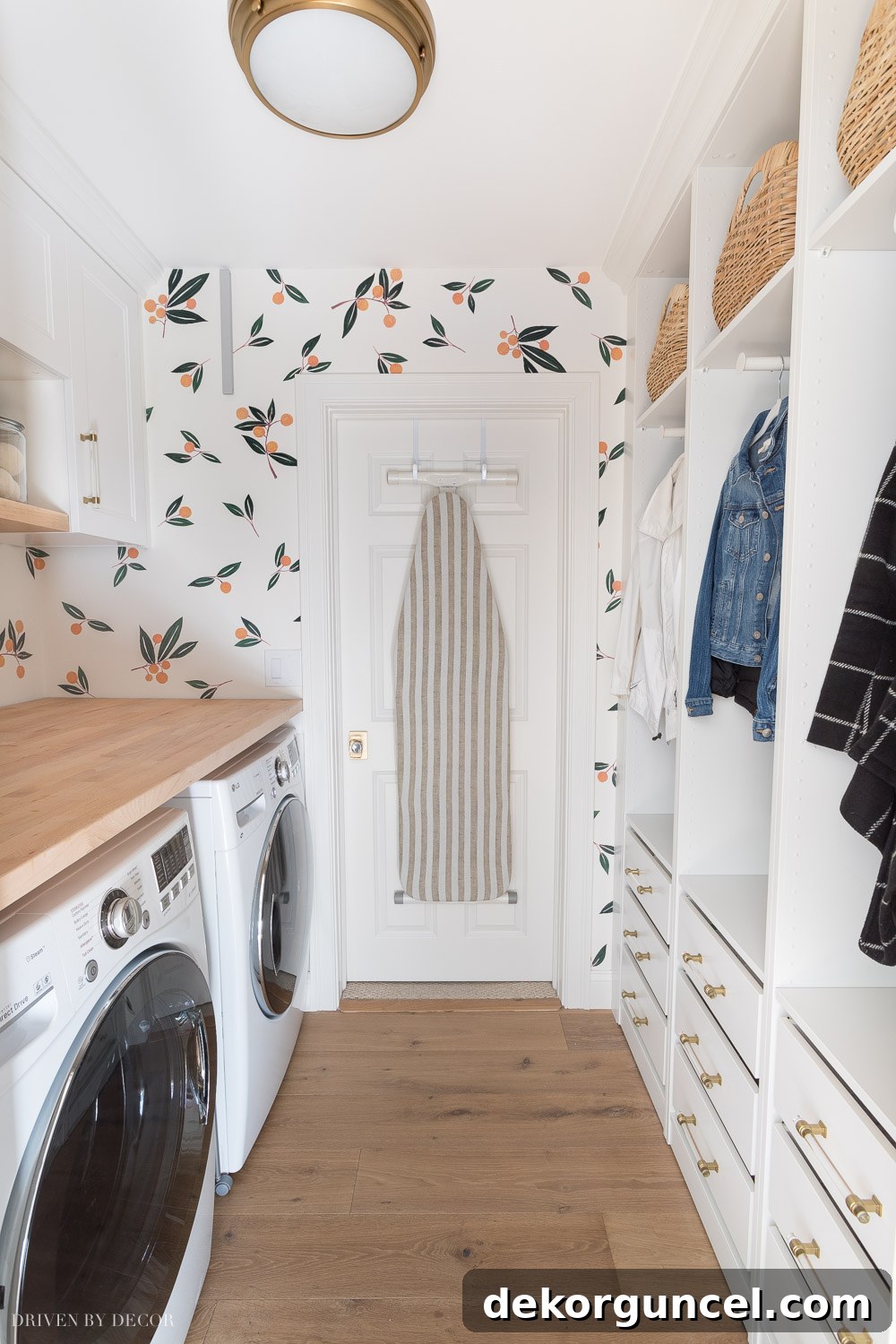 Transformed laundry room with crisp IKEA cabinets and wardrobes, creating abundant storage and a clean, efficient space.