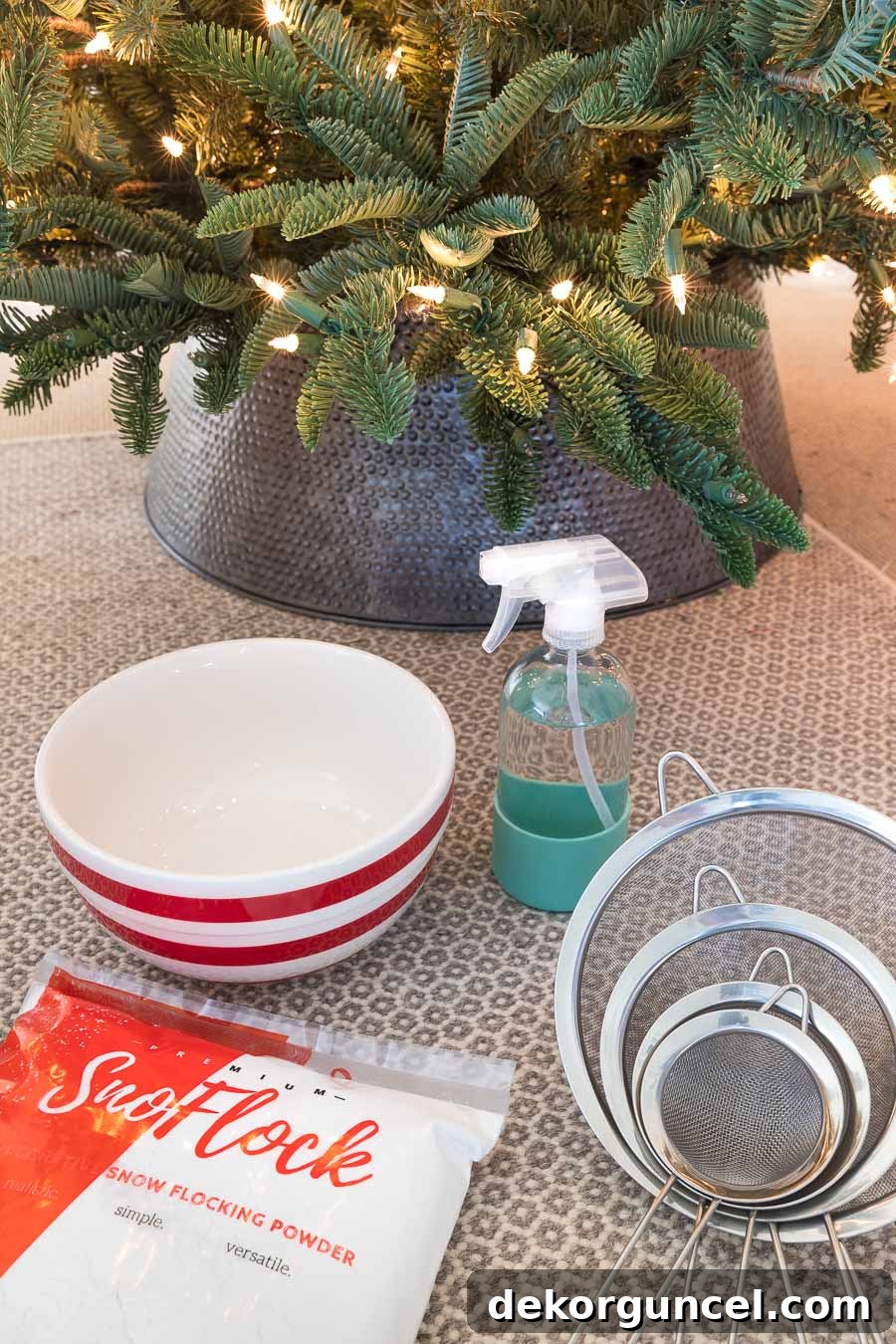 How to Perfectly Flock a Christmas Tree 2 The essential supplies needed for a successful DIY Christmas tree flocking project, including flocking powder, strainers, and protective gear.