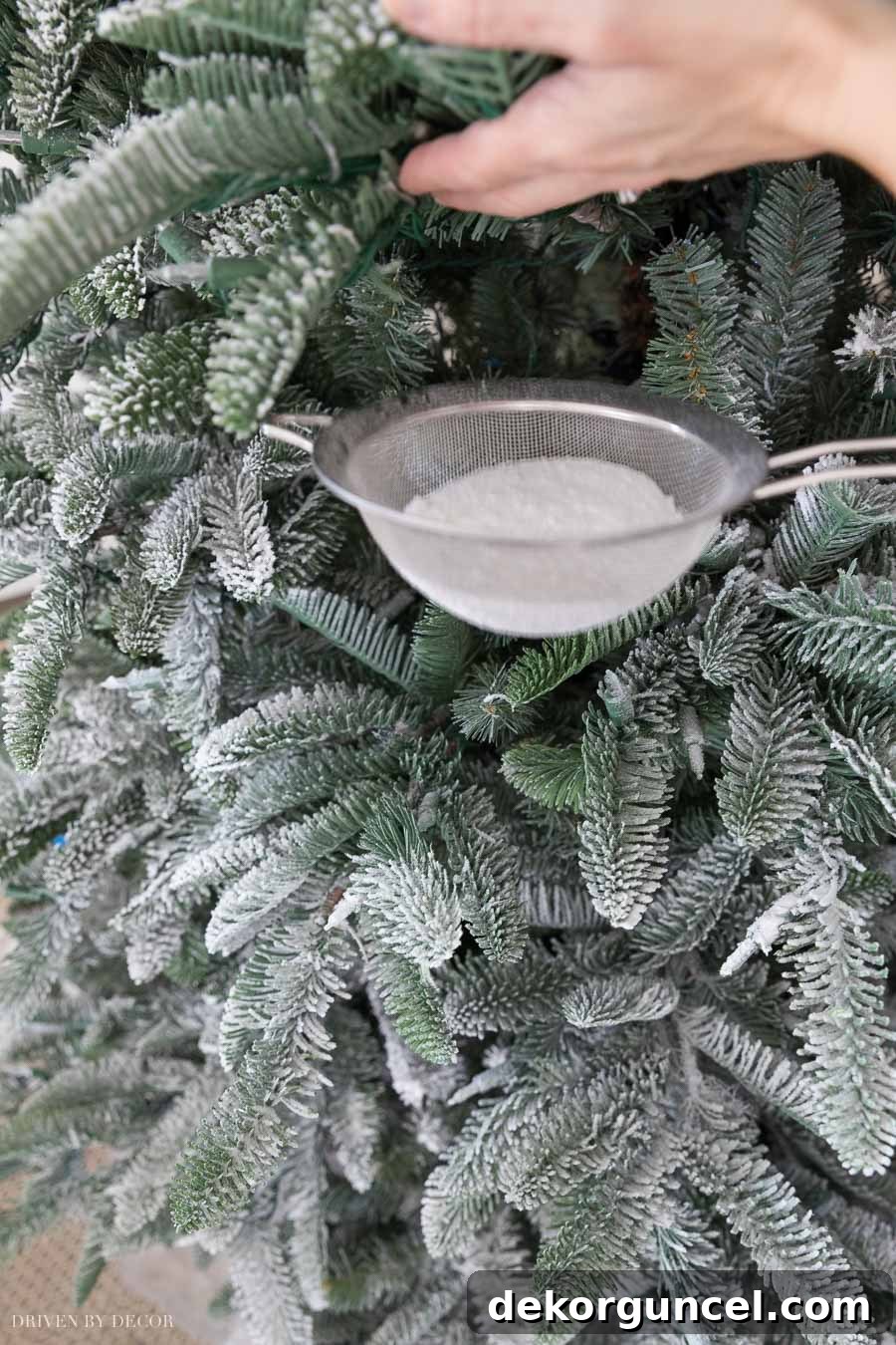 How to Perfectly Flock a Christmas Tree 7 Expert tips and techniques for flocking a Christmas tree, including using smaller strainers for hard-to-reach areas and strategically lifting branches to ensure even coverage.