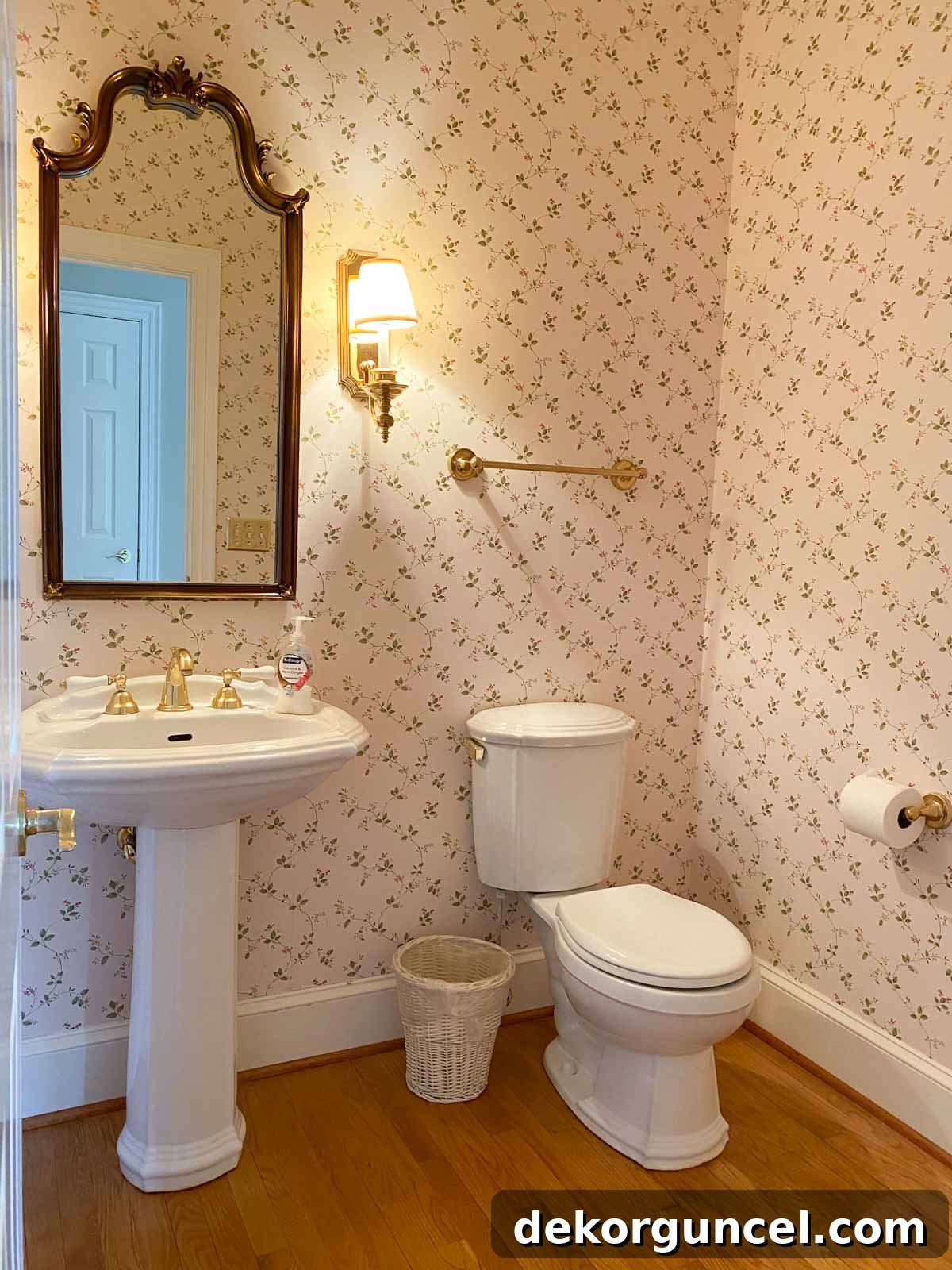 Our powder room before remodeling with a dated pedestal sink