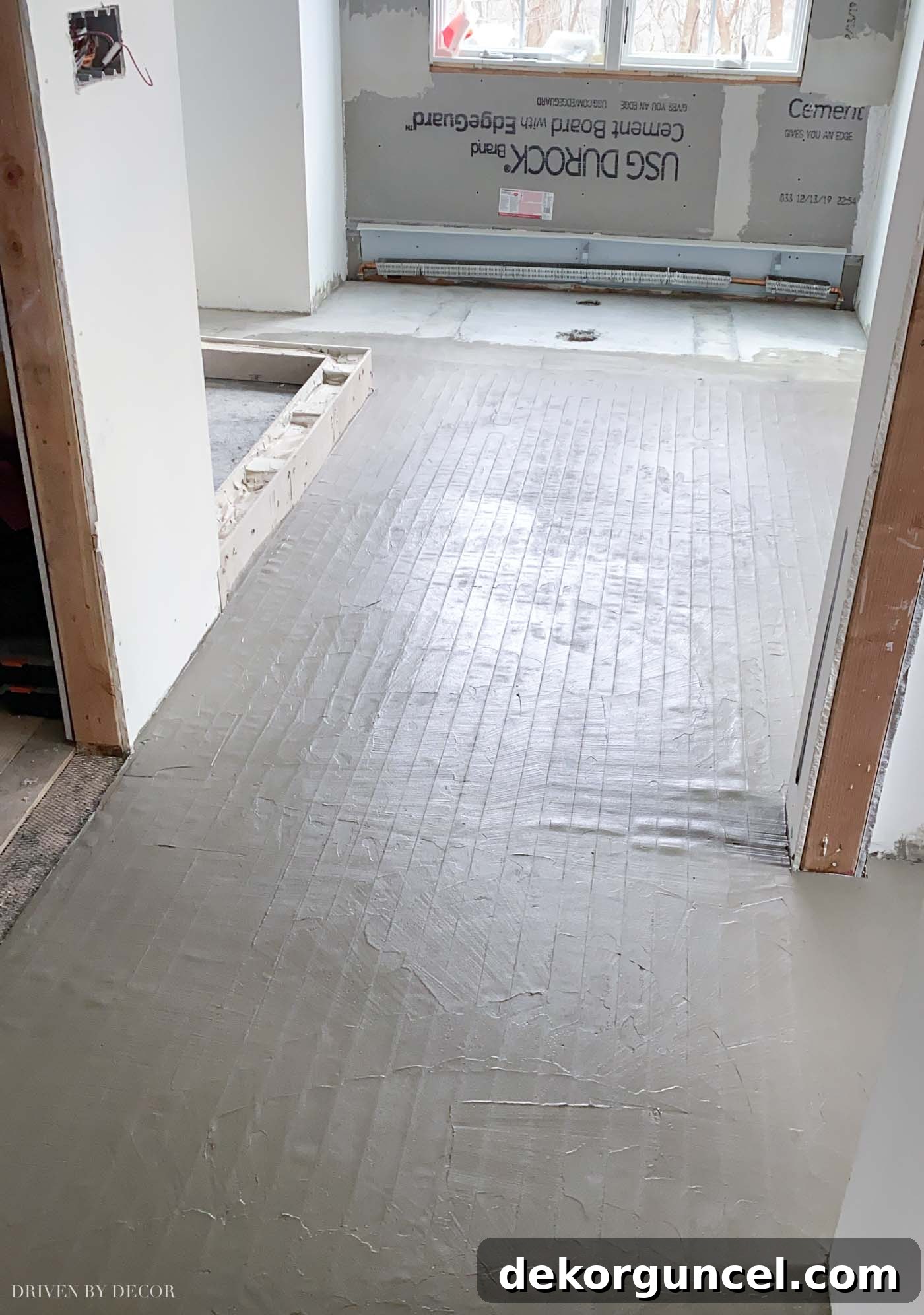 10 Master Bathroom Remodel Ideas You'll Wish Were Yours 13 Preparation for heated floor mat installation before laying tile in a master bathroom remodel.