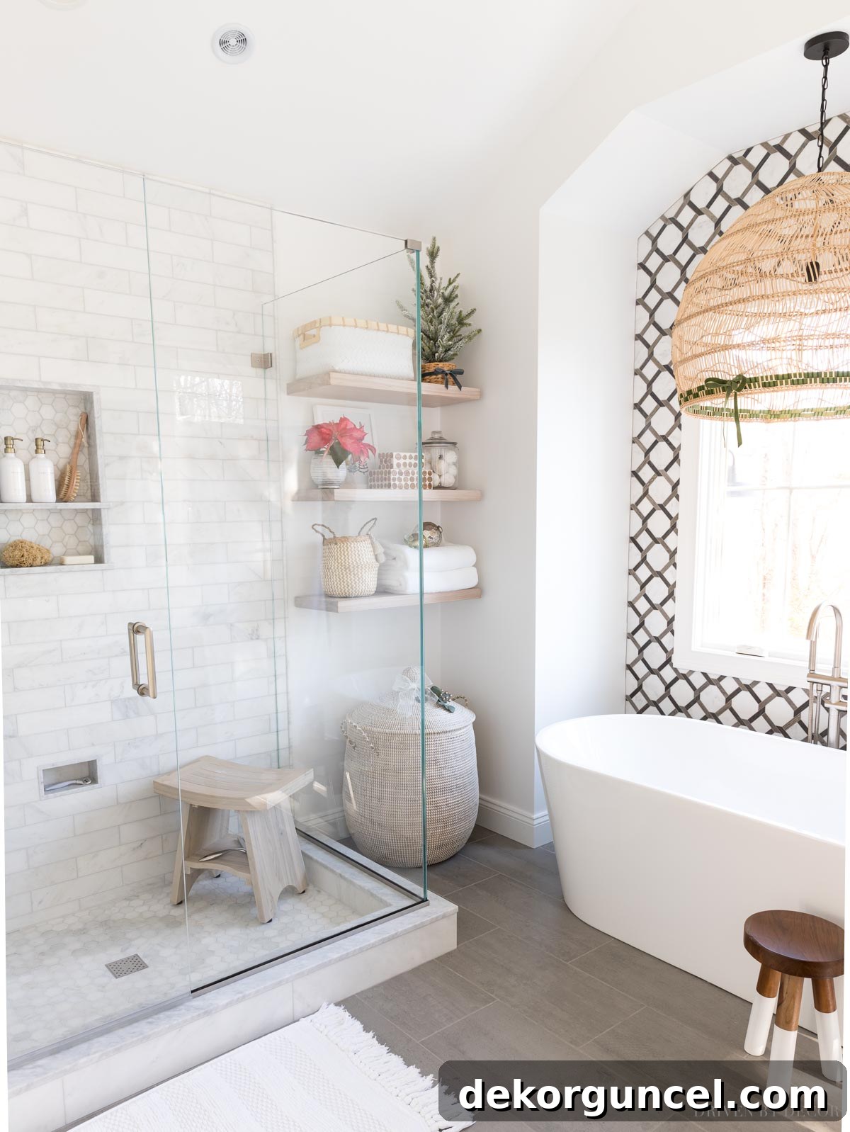 10 Master Bathroom Remodel Ideas You'll Wish Were Yours 19 A gorgeous tiled feature wall behind the bathtub elevates this master bathroom remodel.