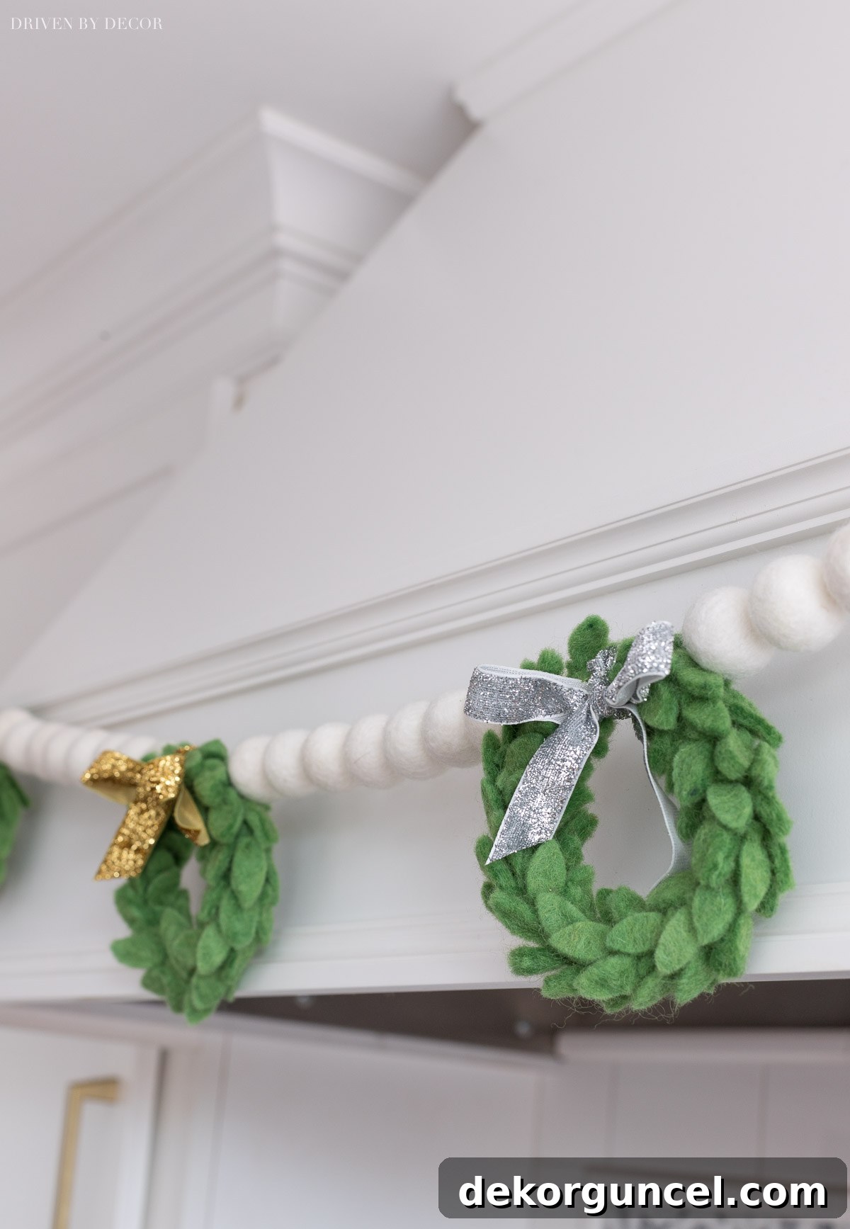 A close-up view of the beautiful handmade felt wreath garland, highlighting its intricate details and festive charm.