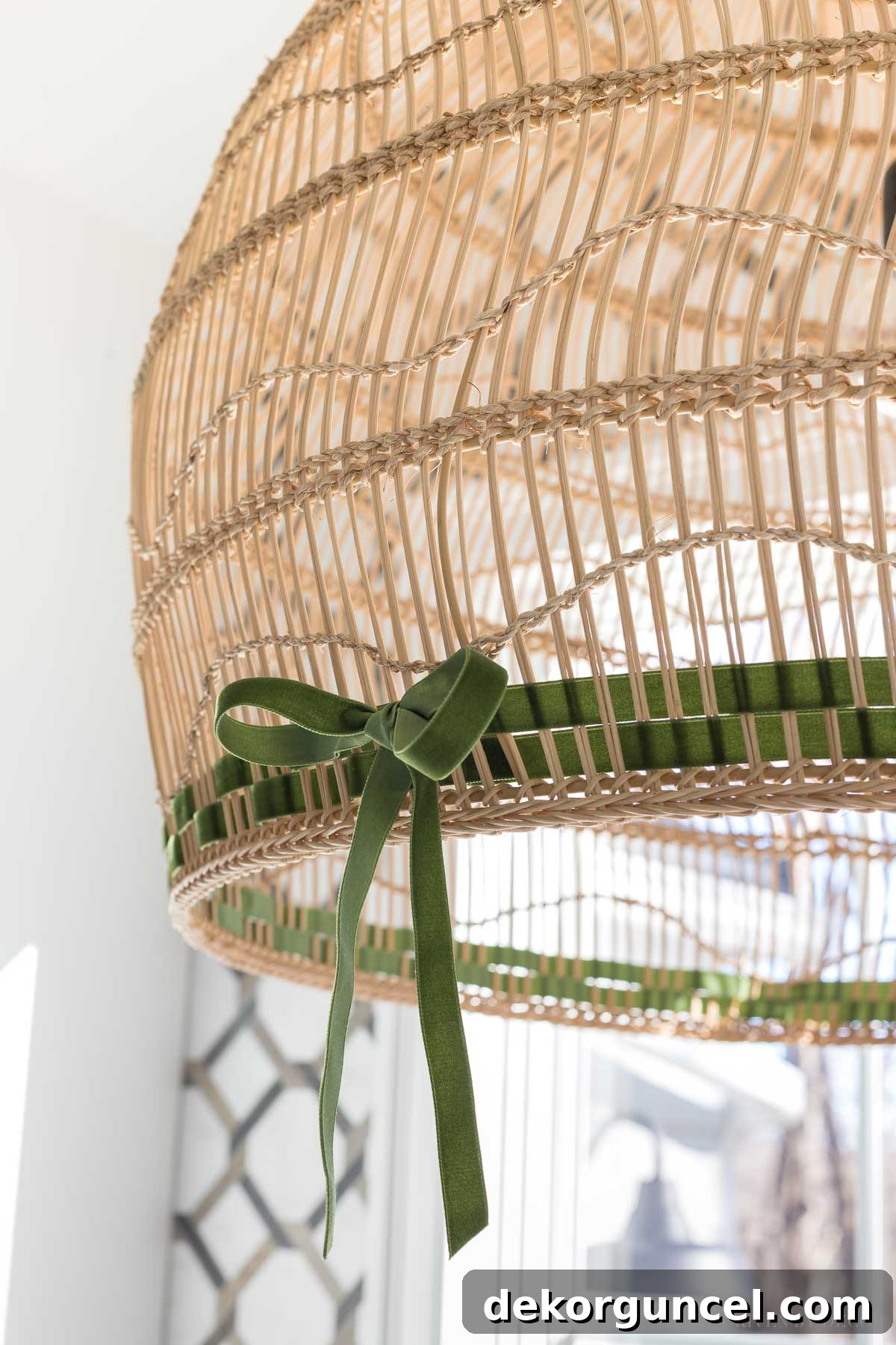 Captivated by this beautiful woven pendant light fixture gracefully suspended above the bathtub in her master bathroom, adding a touch of natural elegance.