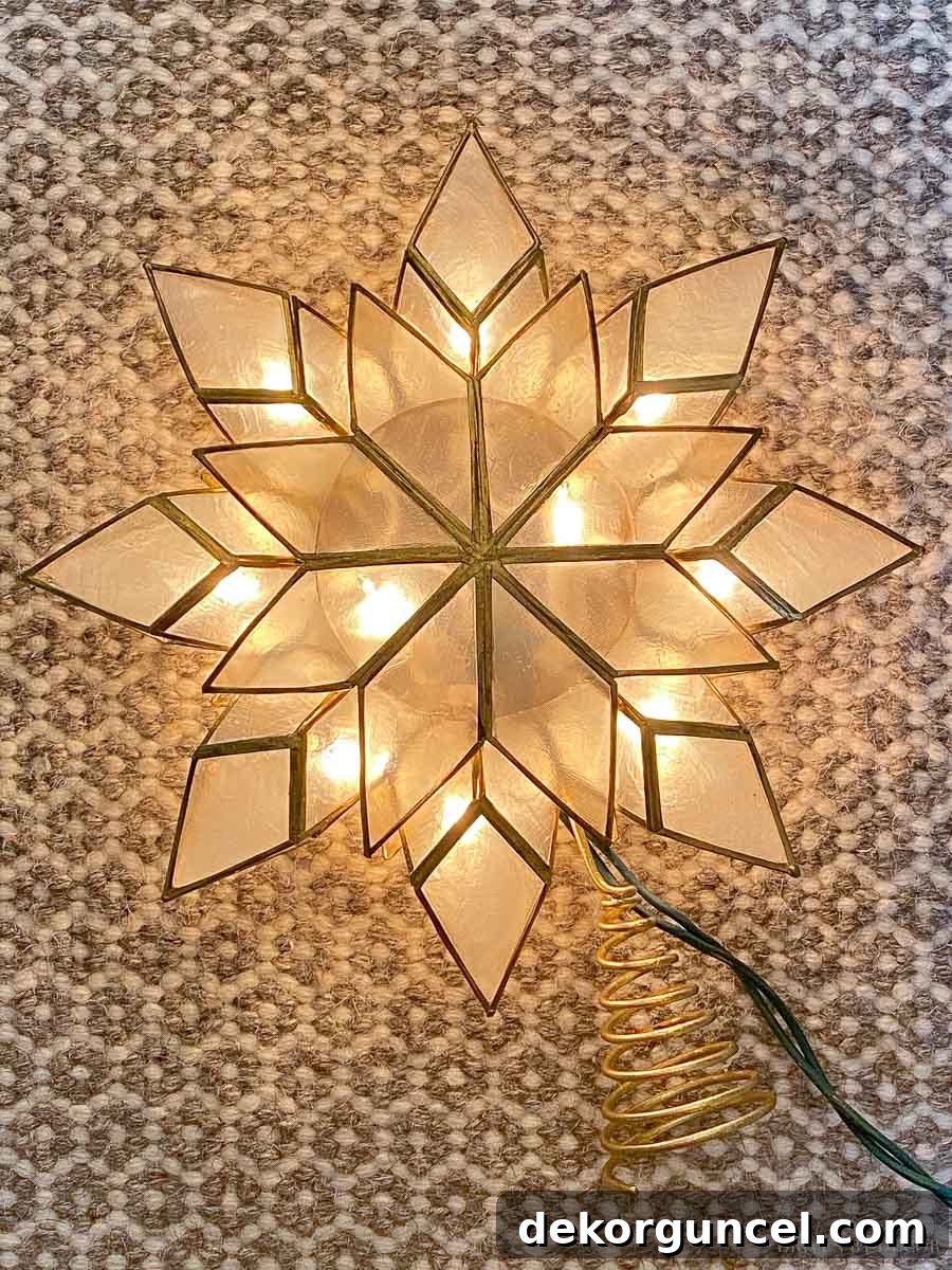 Absolutely love this magnificent capiz star tree topper; its illuminated presence adds a gorgeous focal point to any Christmas tree.