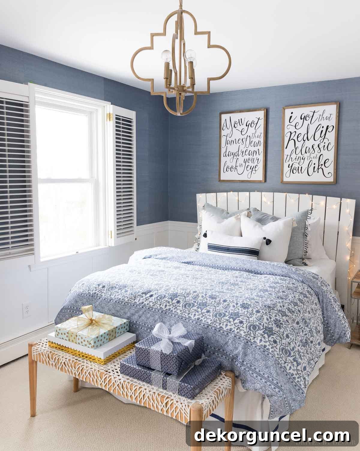 This elegant blue and white bedroom, beautifully adorned for Christmas, exudes a serene and festive charm with minimal, tasteful decor.