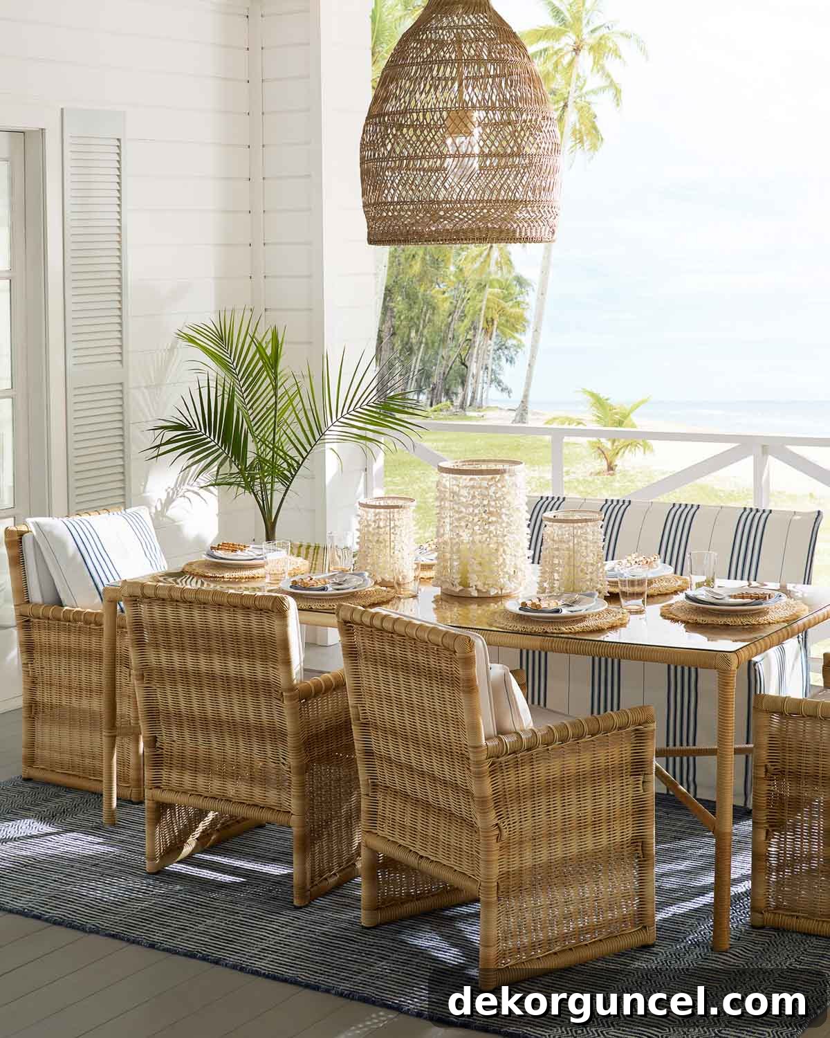 Outdoor entertaining is a major 2021 trend, showcasing a beautifully styled patio with elegant dining furniture and ambient lighting, perfect for social gatherings.