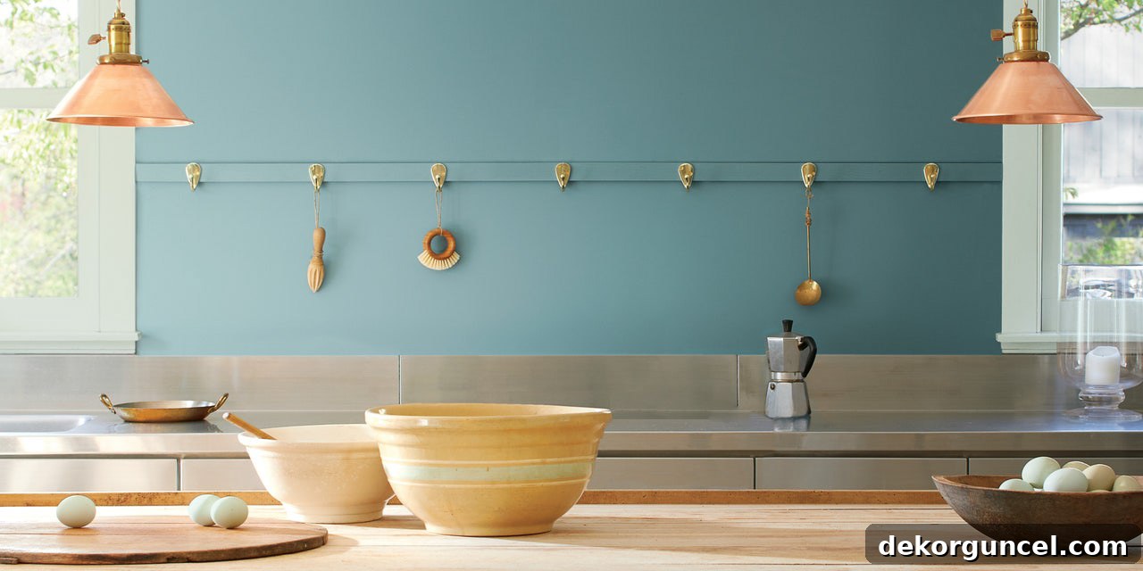 Benjamin Moore's 2021 Color of the Year, Aegean Teal, an intriguing and deeply soothing blue-green hue, featured in a beautifully styled interior.