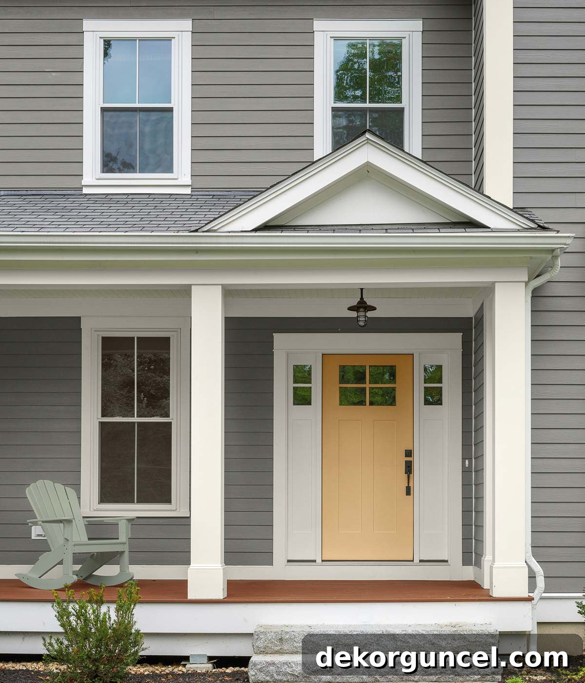 Behr's 2021 paint colors, including the beautiful Barnwood Gray siding and complementary door colors, highlight the trend towards elevated comfort in home design.