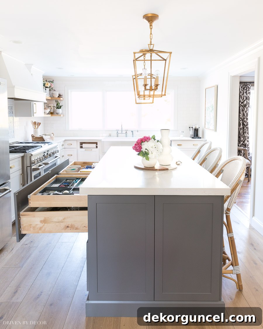 Love the idea of a smaller rolling drawer within the larger drawers of this kitchen island for ultimate desk organization!