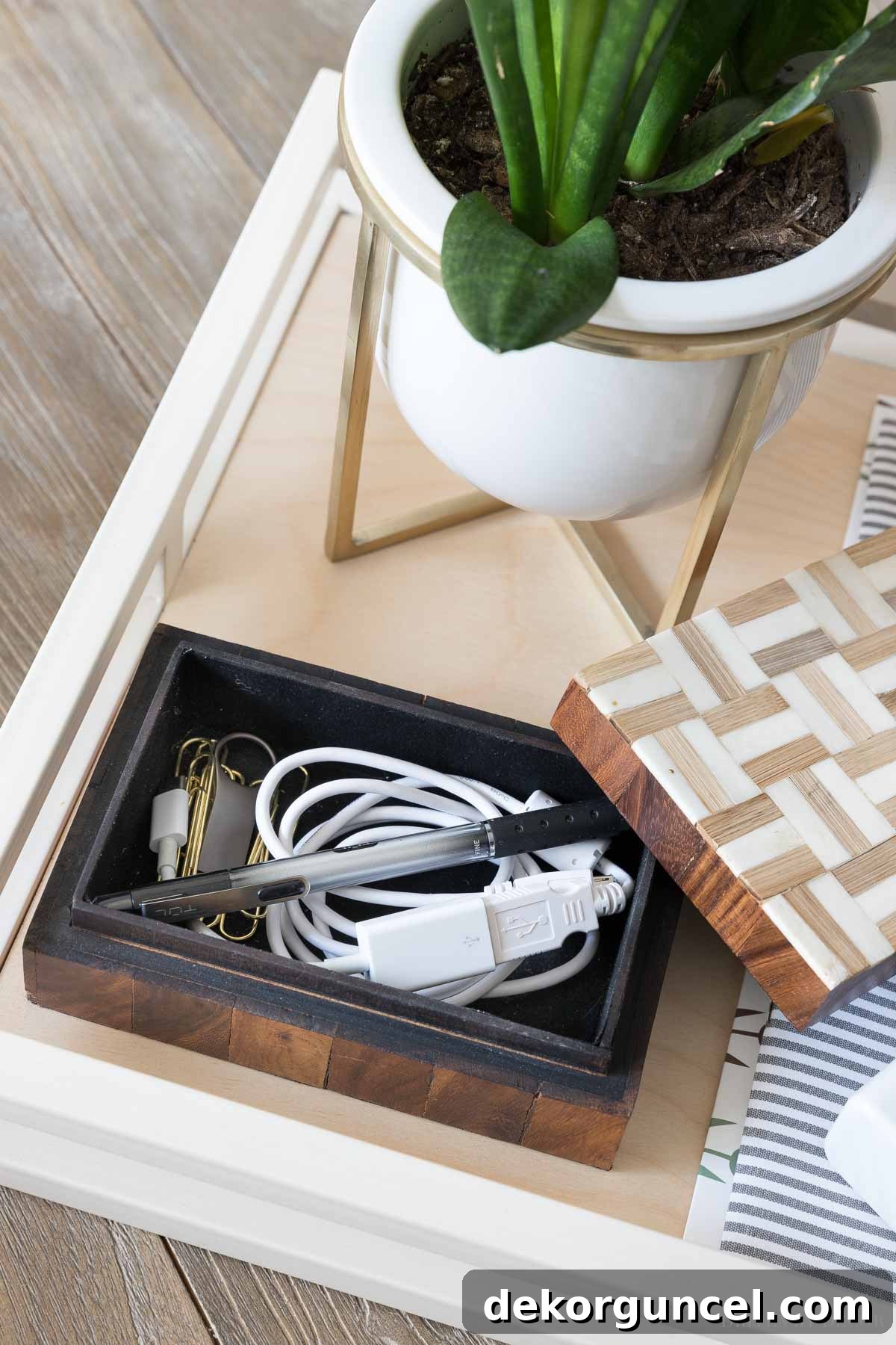 A smart idea for keeping your desk organized and neat: use a small decorative box for computer cords, a pen, paperclips, and other most-used office supplies.
