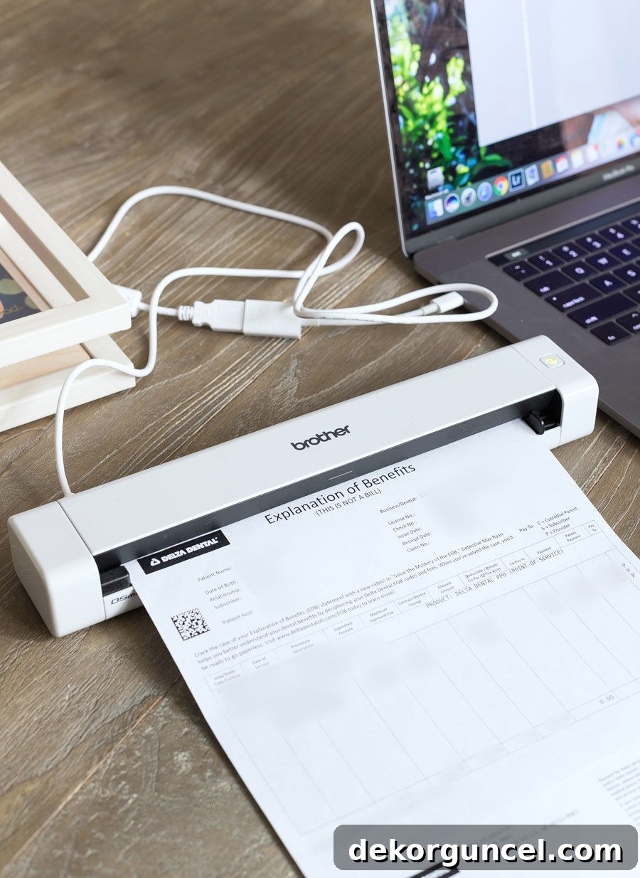 Love the practicality of a handheld mobile scanner for paperwork – a fantastic desk organization idea!