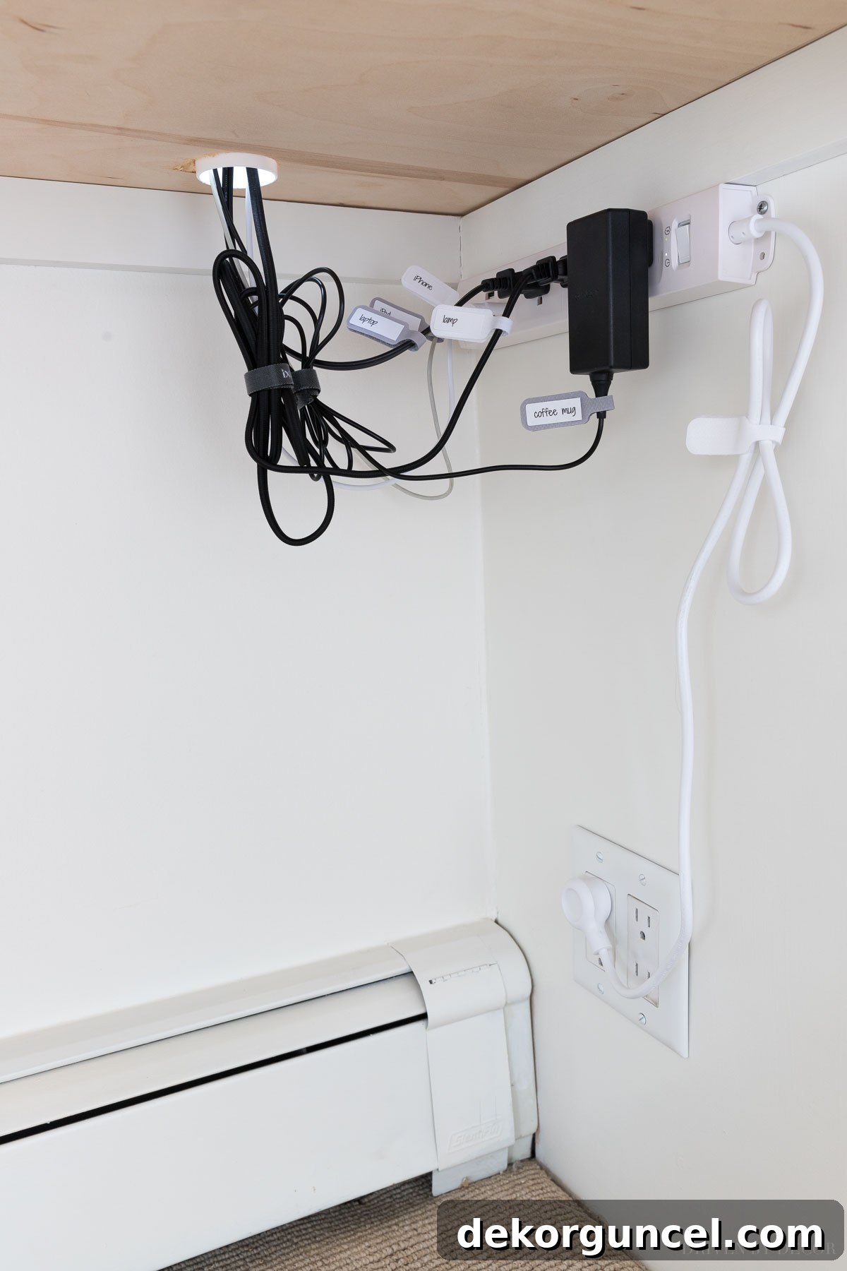 How we discreetly manage cables under our desk - an essential desk organization idea for a clean setup.