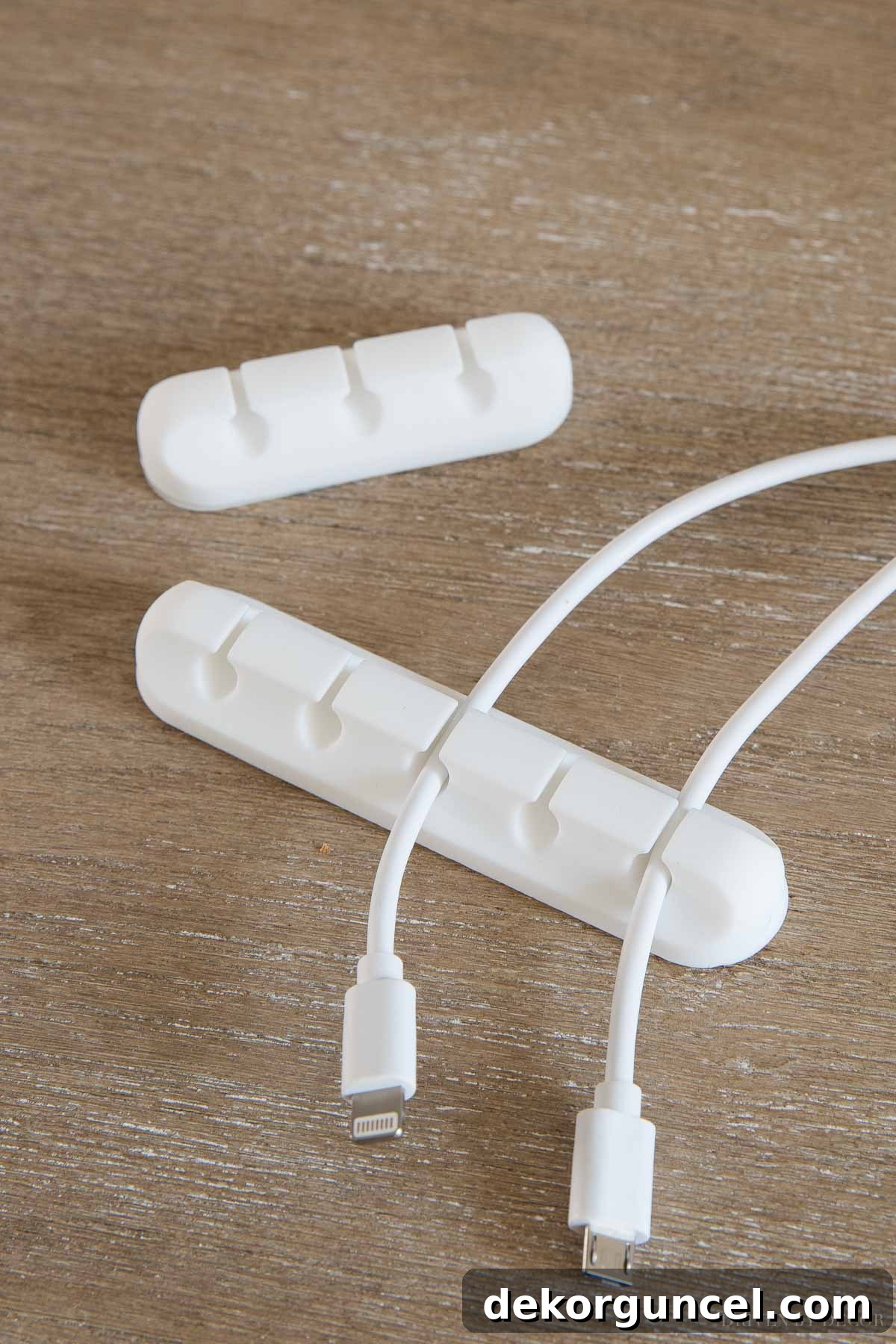 These adhesive cord holders are fantastic for preventing cords from slipping behind your desk, a simple yet effective desk organization idea!