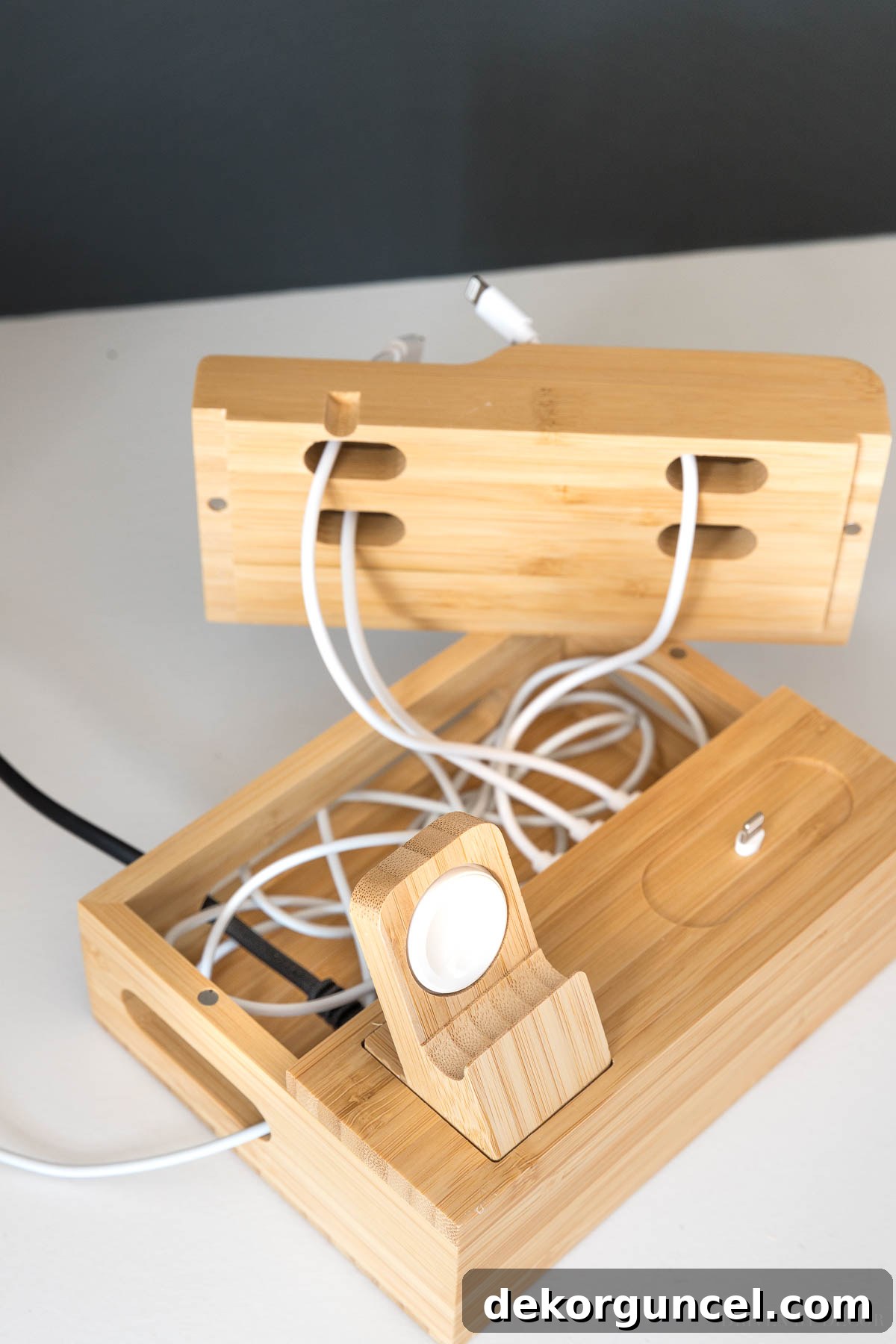This compact charging station is brilliant for hiding messy charging cords inside, a key desk organization idea for a clean look!