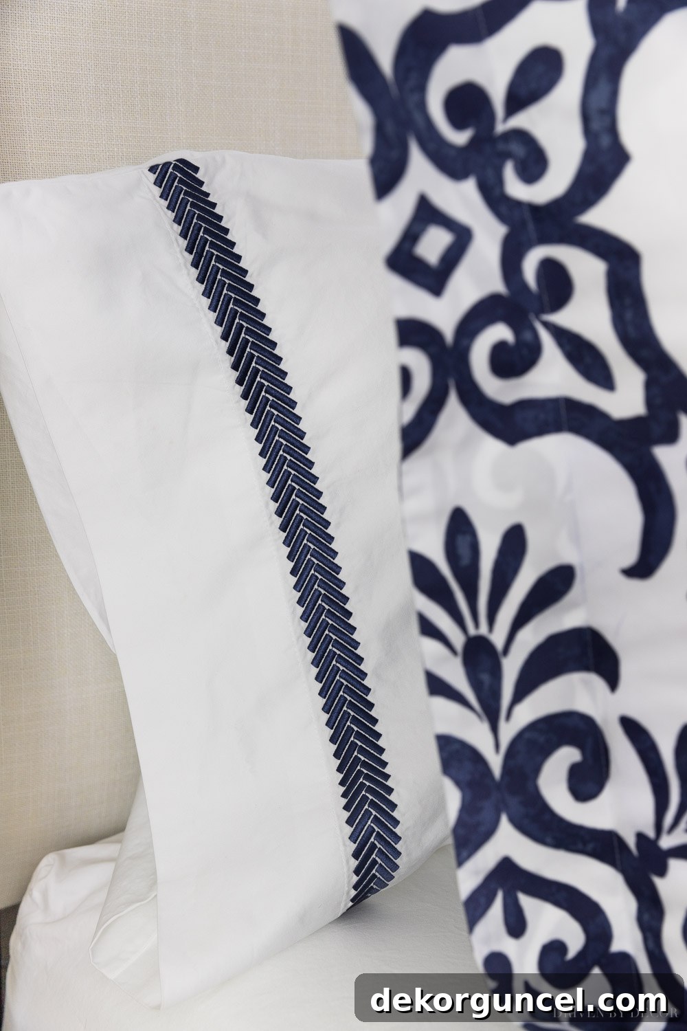 The Ultimate Guide to Fluffy Duvet Inserts 7 Secrets for a Luxurious Hotel Bed 13 Close-up of luxurious navy embroidered edge pillowcases, a detail for elevated bedding.