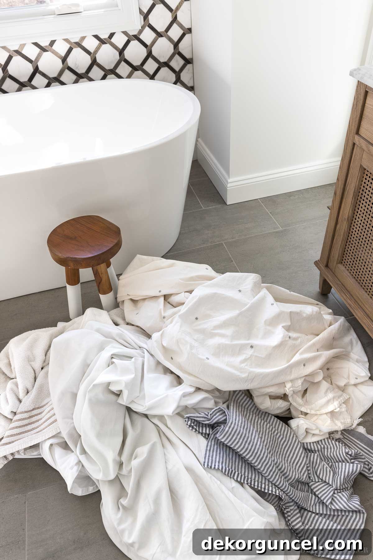 This laundry strip recipe gets so much built up grime out of clothes, sheets, and towels! Witness the deep cleaning power.