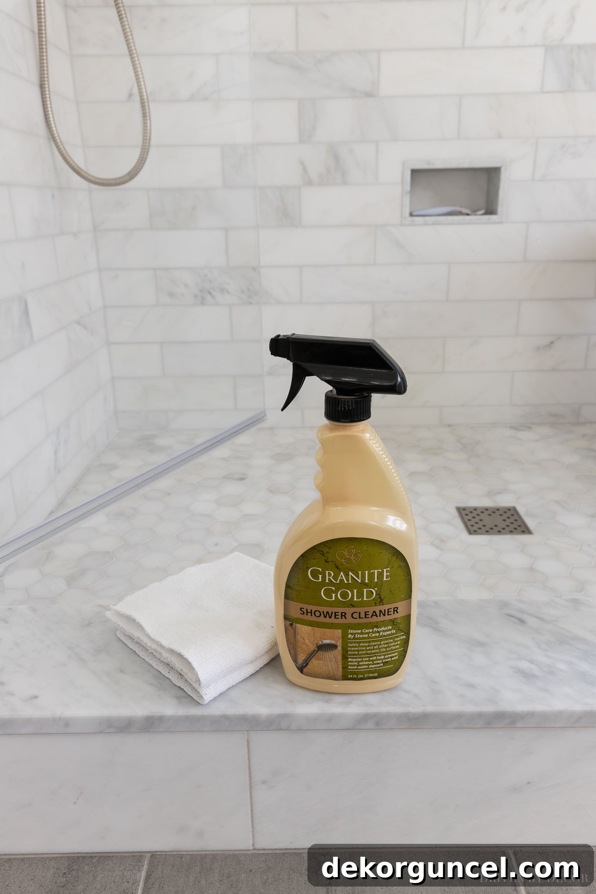 Recommended pH-balanced cleaner for safely cleaning marble shower tiles without damage.