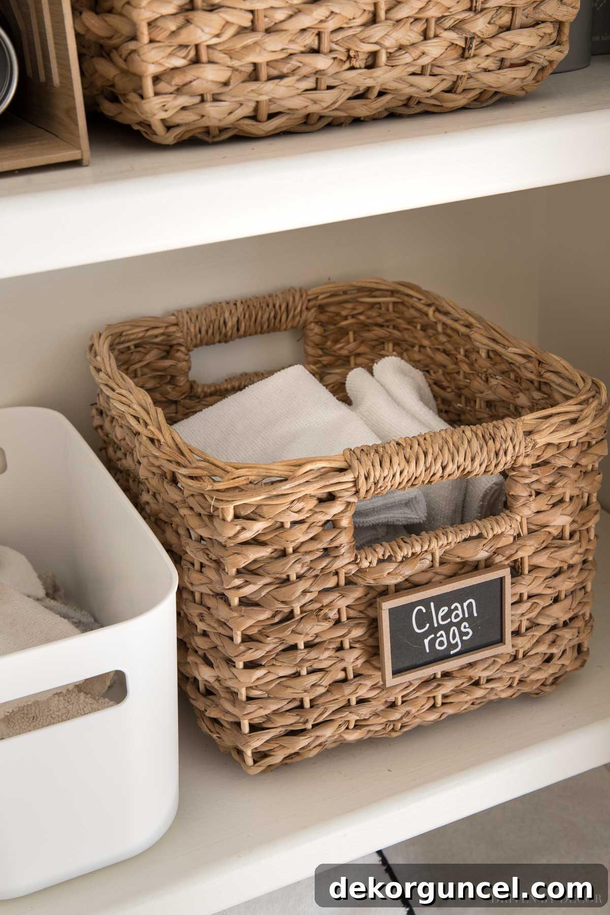 Bulk pack of microfiber cloths stored in a woven basket, ideal for streak-free cleaning of marble bathrooms.