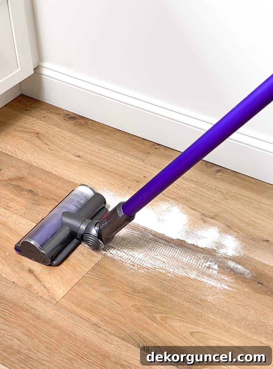 Shark vs. Dyson Cordless Showdown 11 An in-depth comparison of suction power between Shark and Dyson cordless vacuums, tested on various debris on hardwood floors.