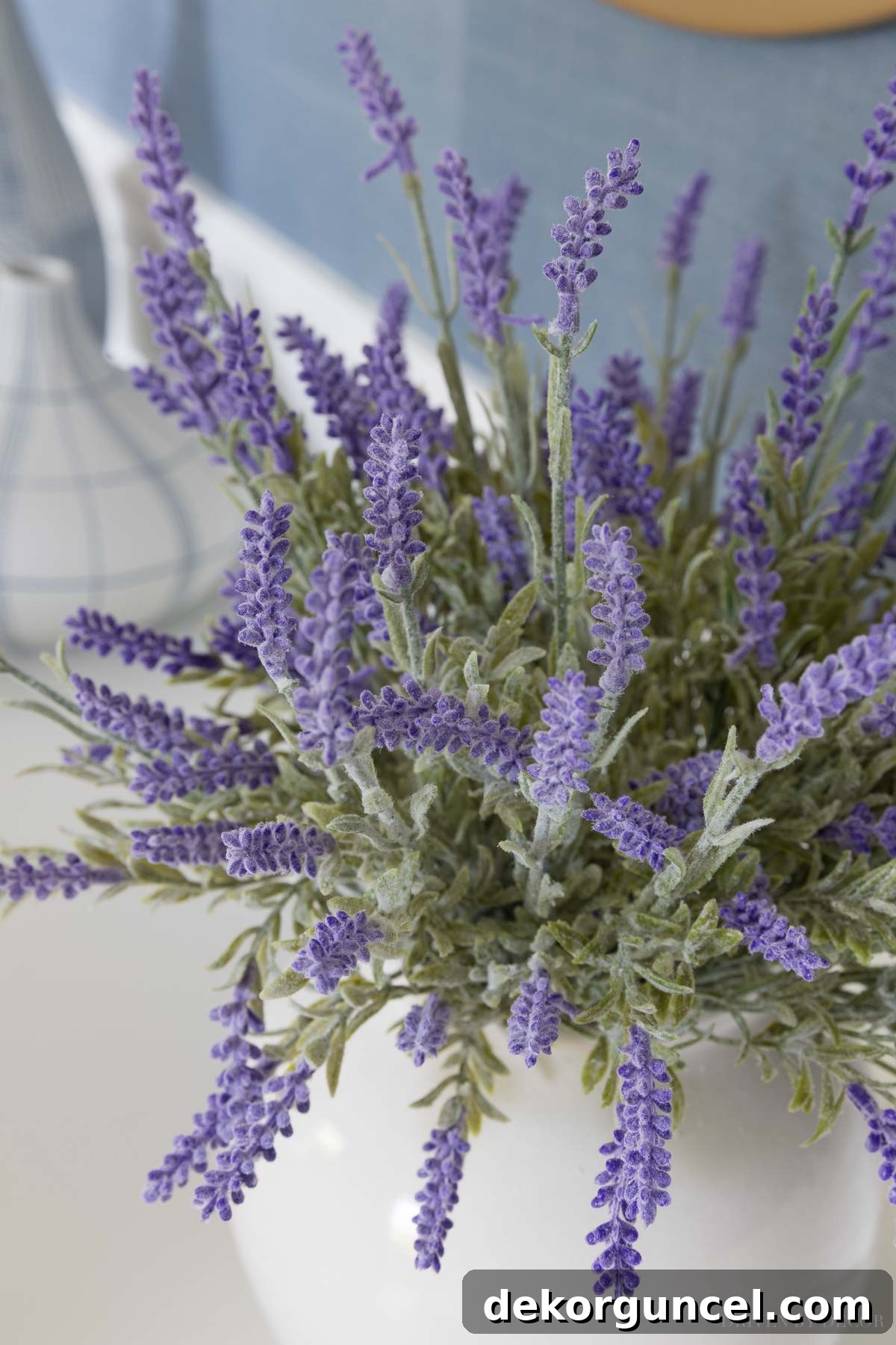 The Most Realistic Faux Flowers 15 Close-up of artificial lavender, highlighting its detailed texture, vibrant purple color, and realistic appearance, arranged beautifully in a daughter's room to add a soft, natural touch.