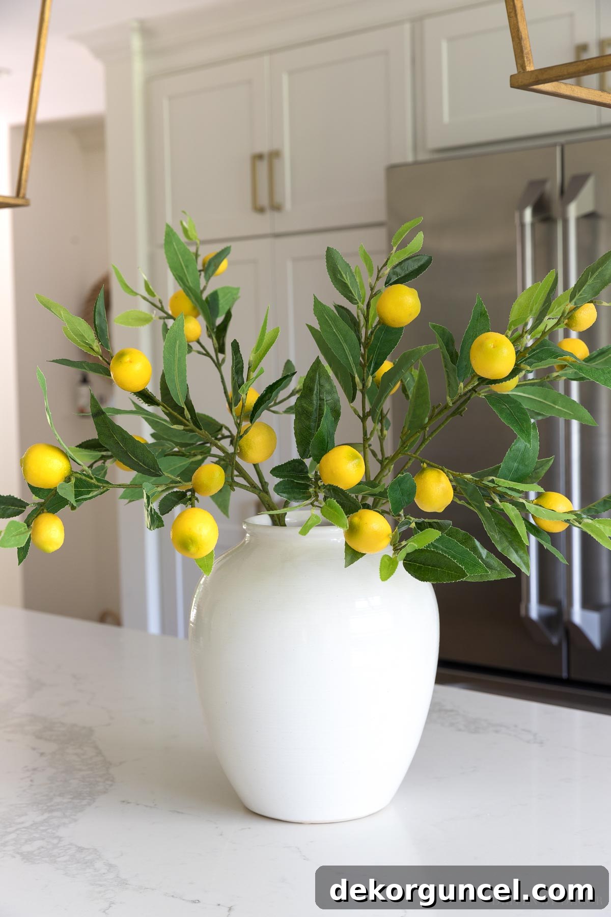 The Most Realistic Faux Flowers 18 After fluffing: Realistic artificial lemon branches beautifully arranged in a kitchen, showcasing their vibrant lemons and lush greenery, proving the dramatic impact of proper styling and fluffing on faux flowers.