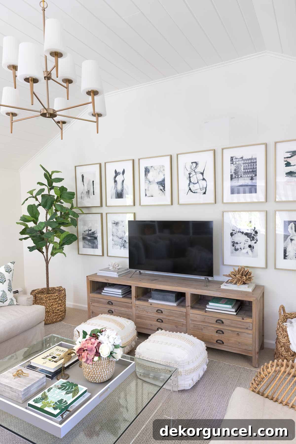 The Most Realistic Faux Flowers 22 A beautifully decorated living room featuring a large, realistic artificial fiddle leaf fig tree and other elegant faux floral arrangements, creating a harmonious and vibrant interior design.