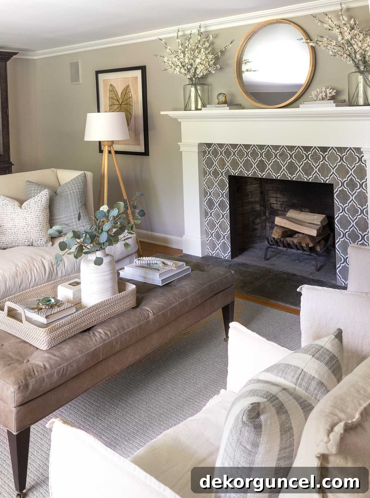 The Most Realistic Faux Flowers 8 Two clear glass vases filled with beautiful and realistic faux white orchids gracing a fireplace mantel in a stylish living room, creating a serene and sophisticated ambiance.