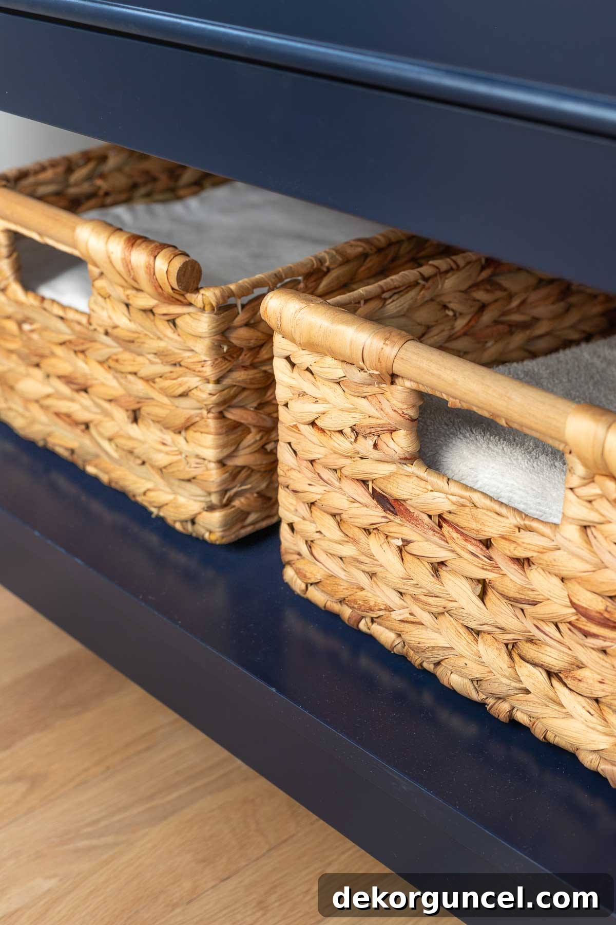 Baskets on bottom shelf of small vanity