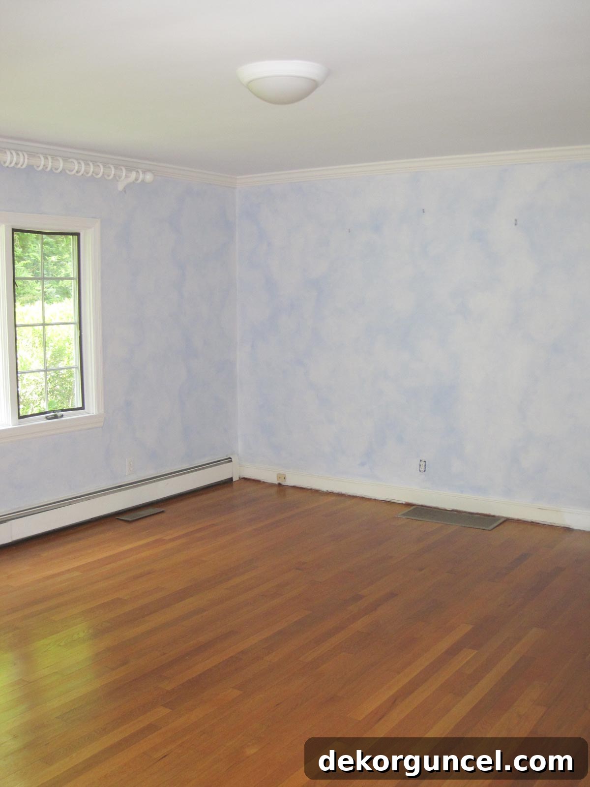Master bedroom before remodeling, showing textured and cracked plaster walls