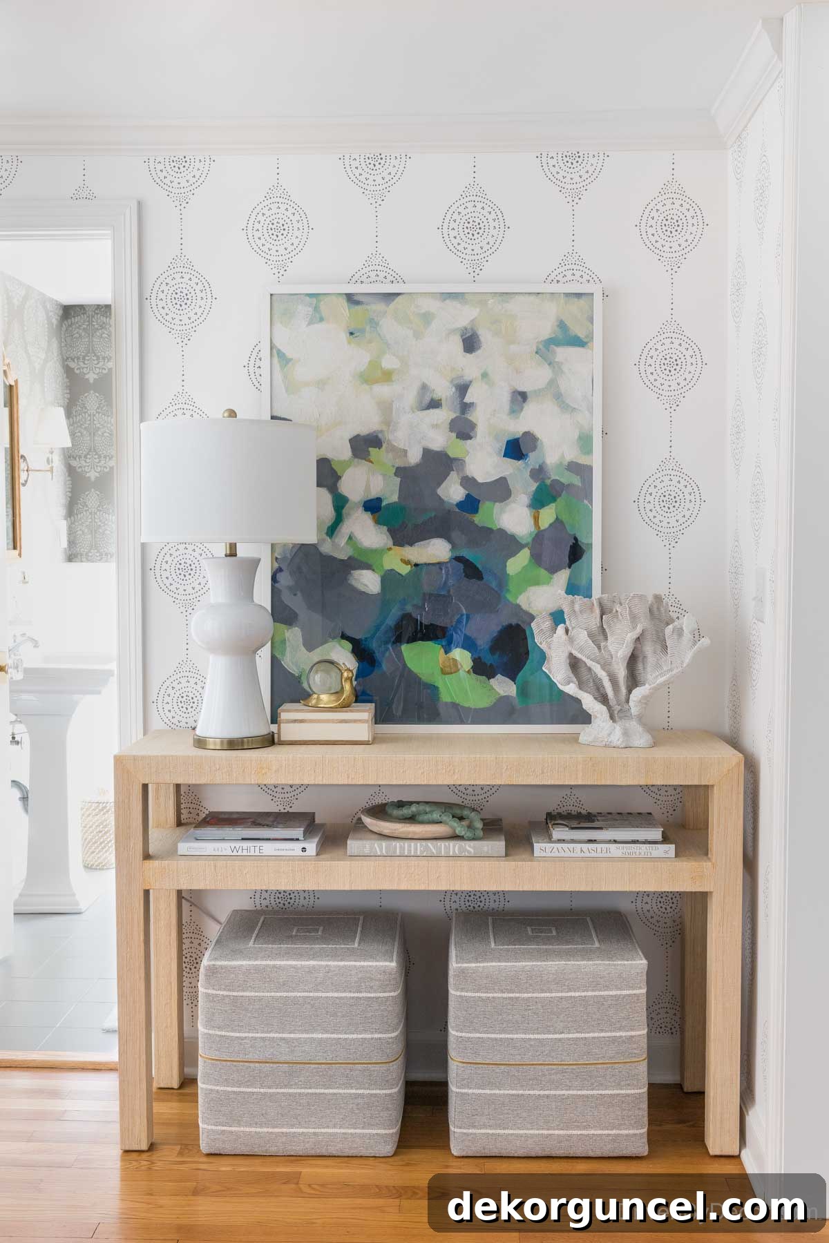 Entryway after remodeling, featuring a stunning wallpaper, new console, and decorative accents