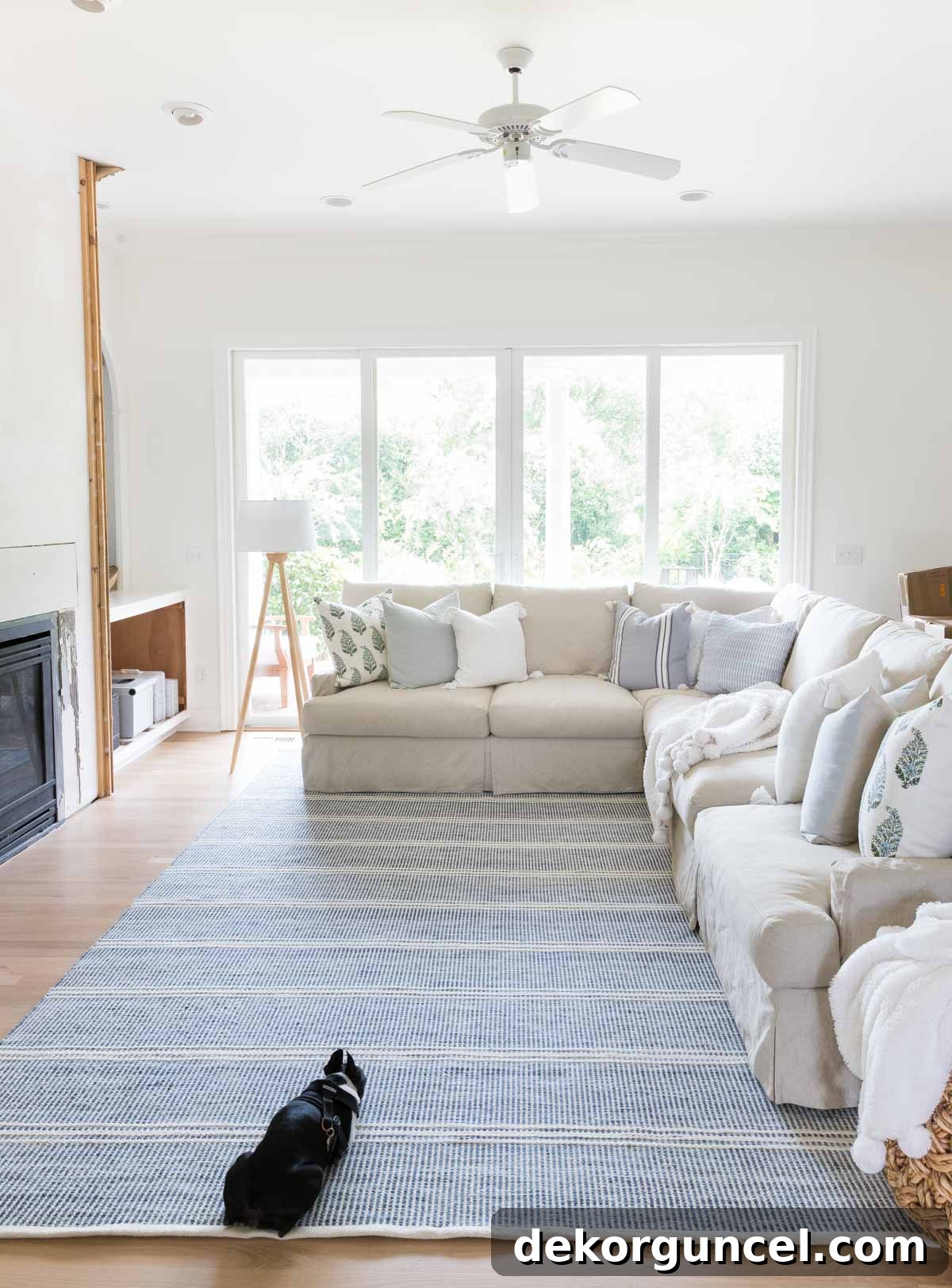 Our family room undergoing a stylish remodel, featuring a new, expansive area rug.