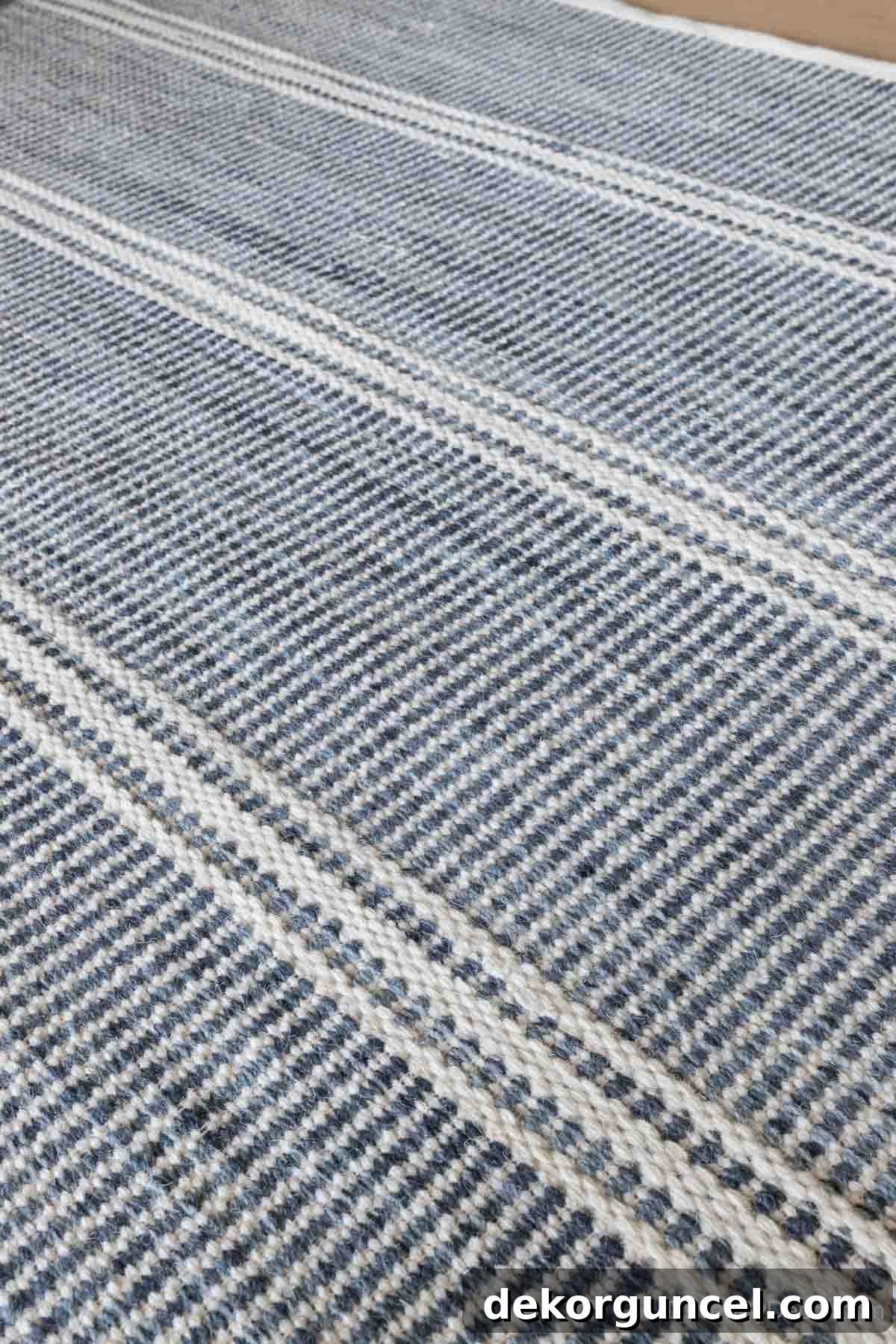 Our elegant blue and white striped family room rug, adding style and comfort to our new home.
