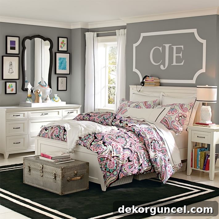 Charming large monogram wall decal as above bed decor in a child's room.