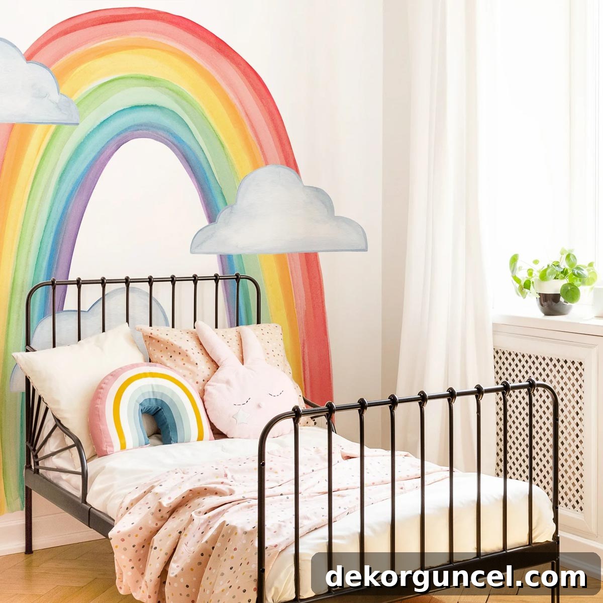 Vibrant large rainbow wall decal serving as cheerful above bed decor.
