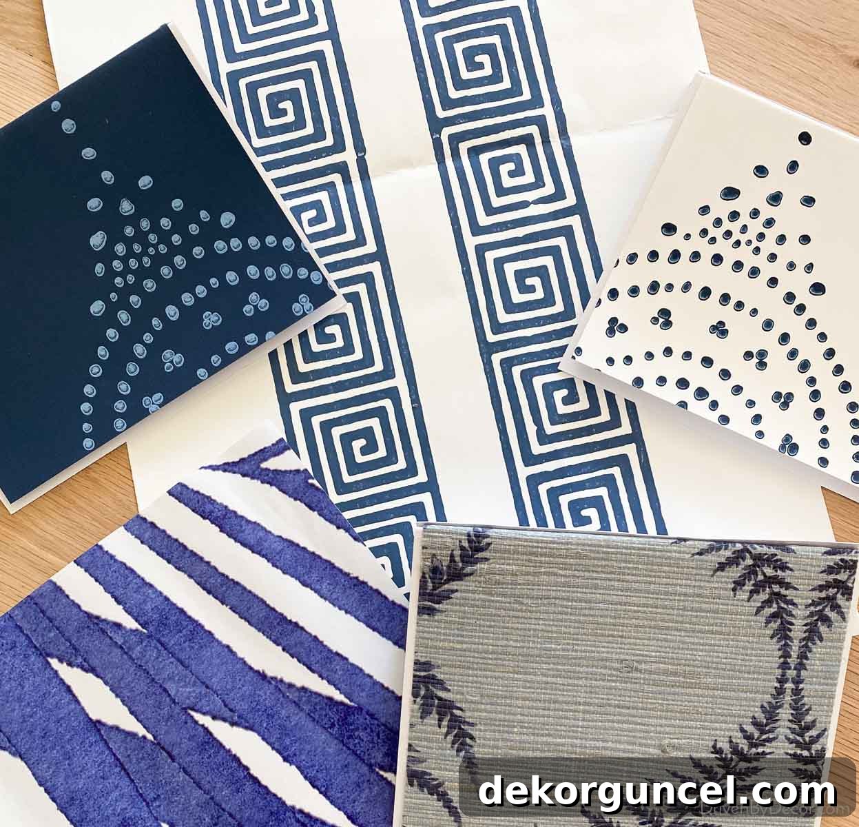 Wallpaper samples that I'll be using to create my own patterned coasters, a clever DIY wallpaper idea!