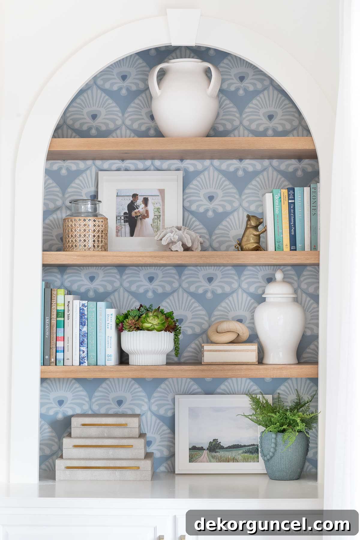 10 Creative Wallpaper Ideas for a Stunning Home Makeover 5 Bookshelf styling with oak shelves and patterned wallpaper on the back panel of the bookcase.