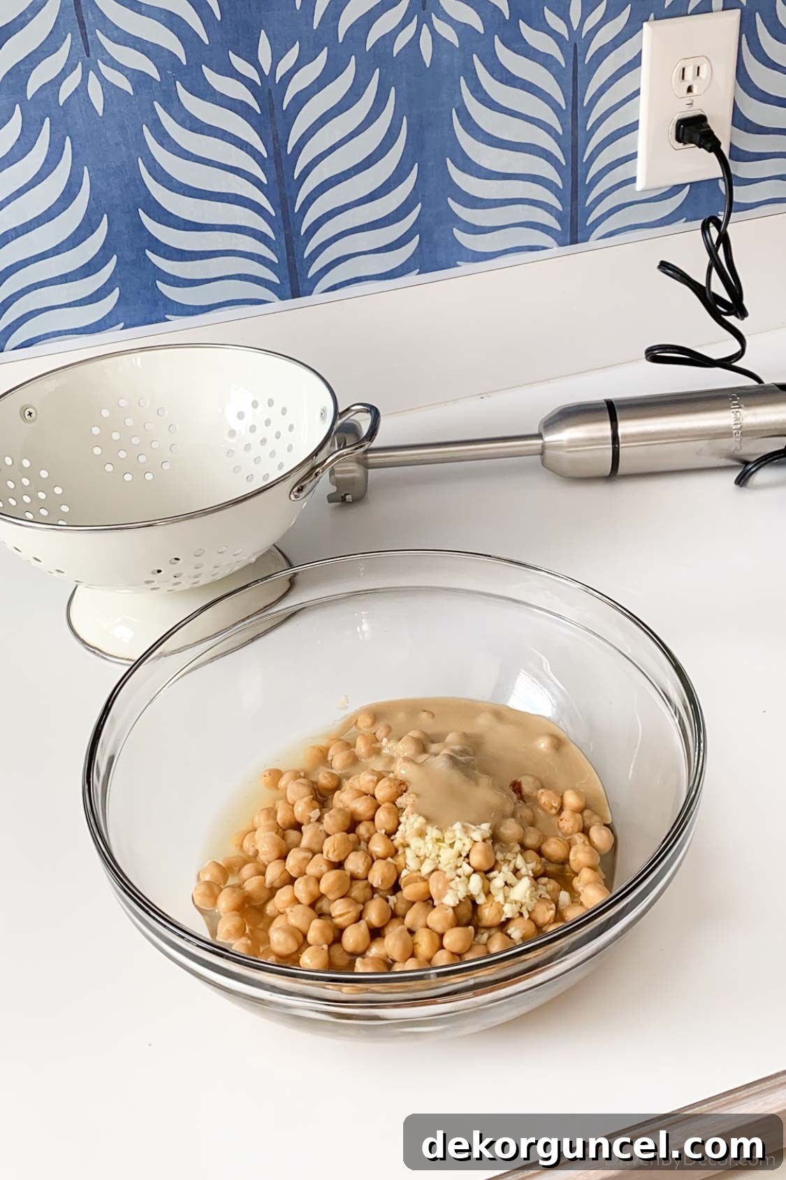 5 Small Kitchen Game Changers And Where to Find Bargains 6 Making delicious homemade hummus with an immersion hand blender.