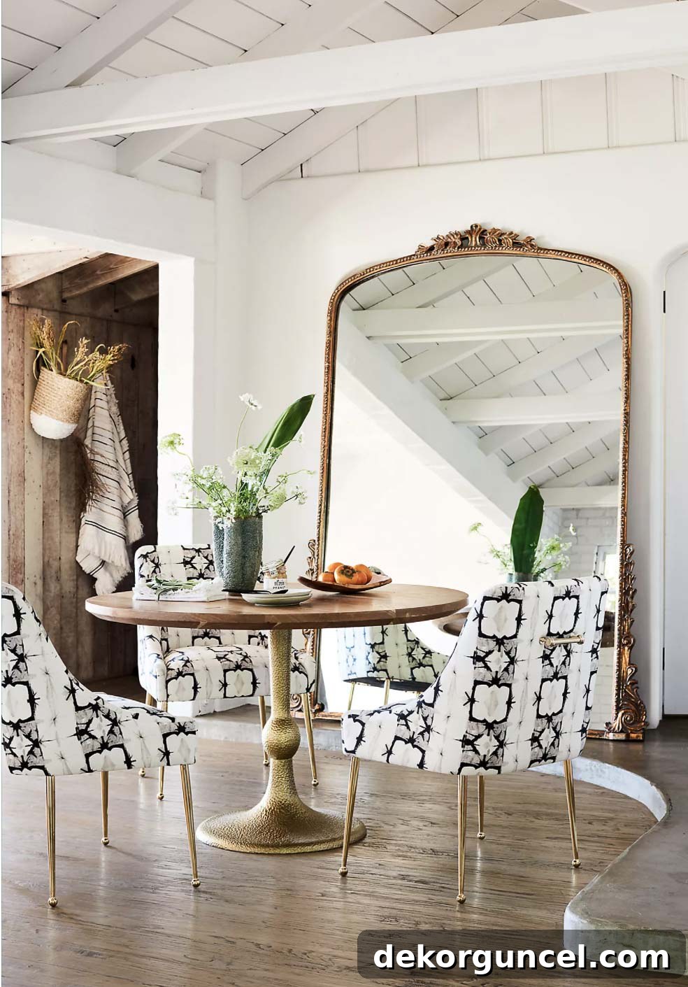 A stunning floor mirror serves as captivating wall decor in a dining room, adding depth and reflecting ambient light beautifully.