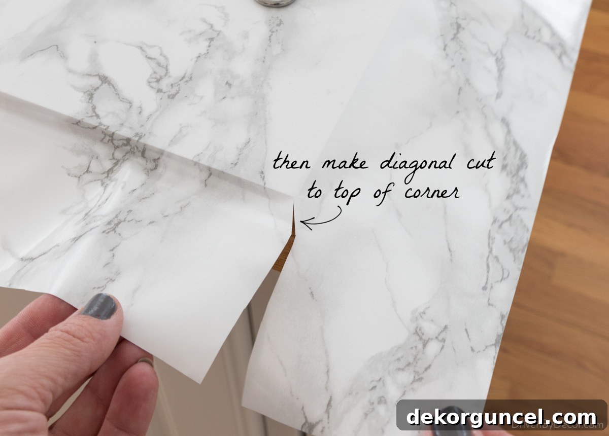 Second relief cut for perfectly folding marble contact paper corners