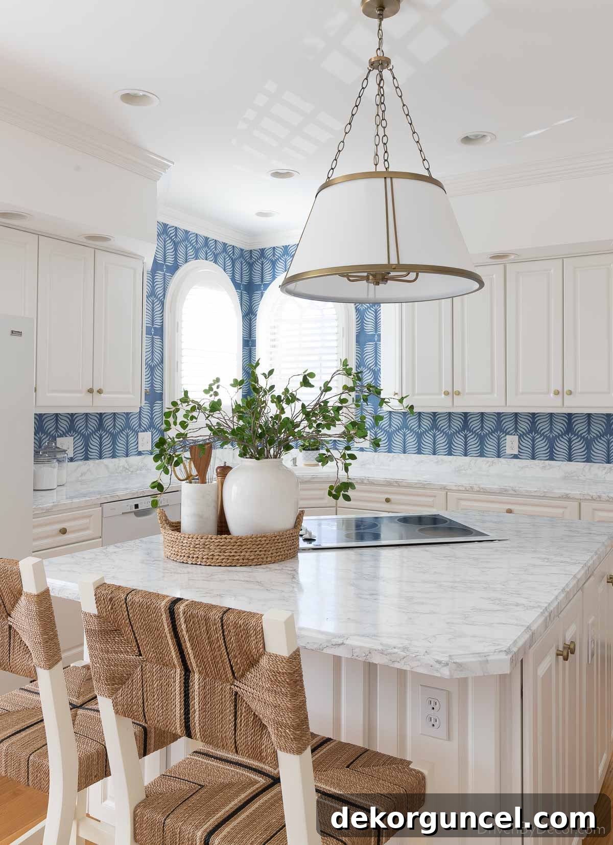 The stunning results of our budget-friendly kitchen remodel with marble contact paper countertops!