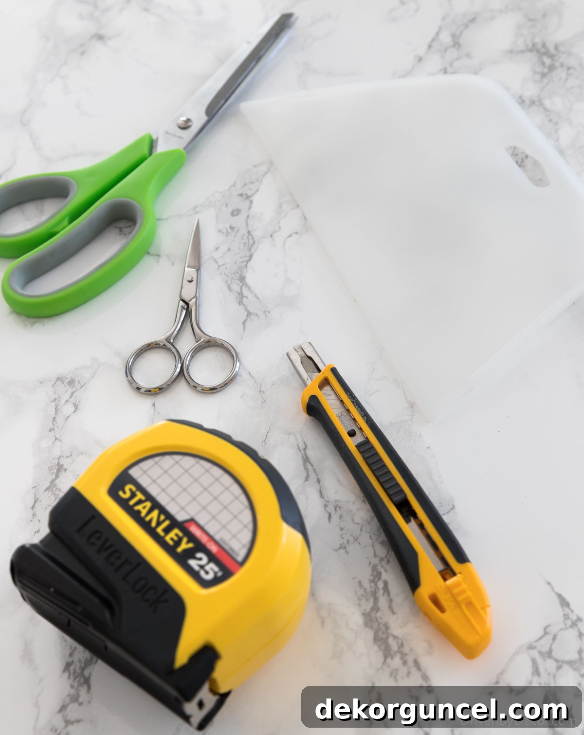 Essential tools and supplies for covering countertops with contact paper