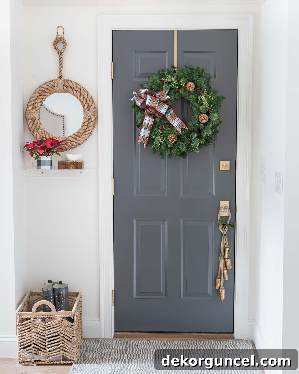 Christmas wreath hung on the inside of a door using a wreath hanger, adding interior holiday decor